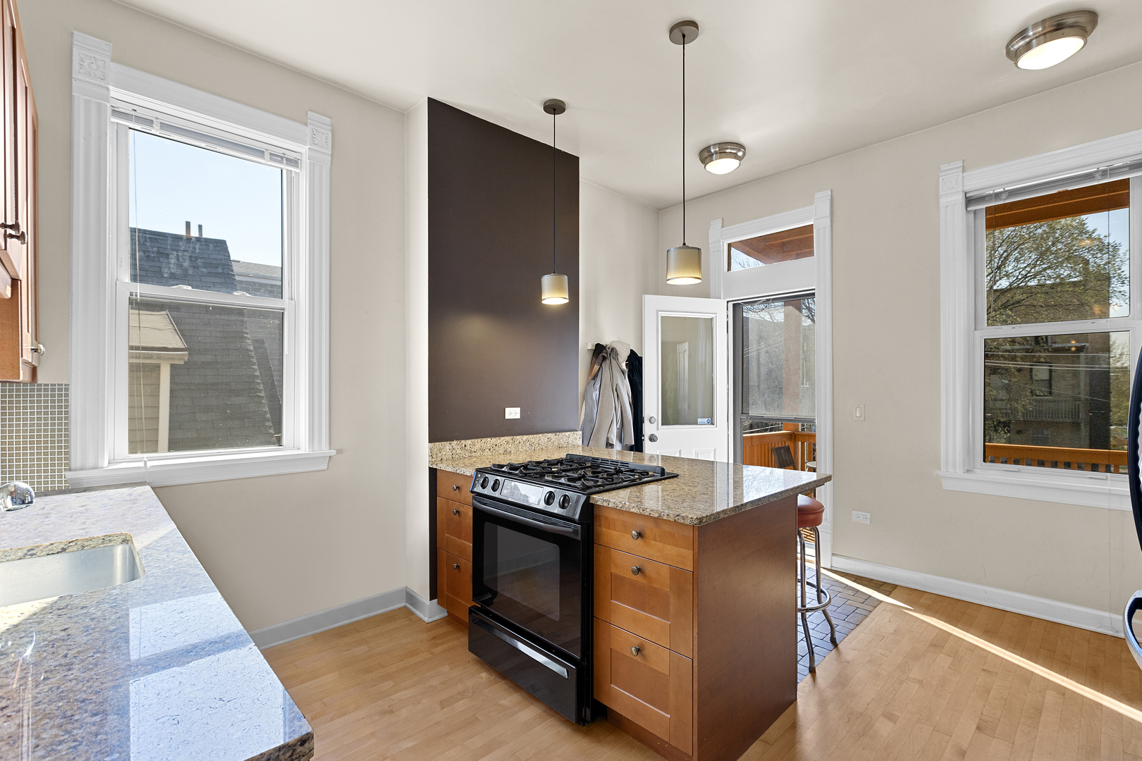929 West Fletcher Street Chicago, IL 60657 - Photo 45 of 53 a kitchen with stainless steel appliances granite countertop a stove and a window