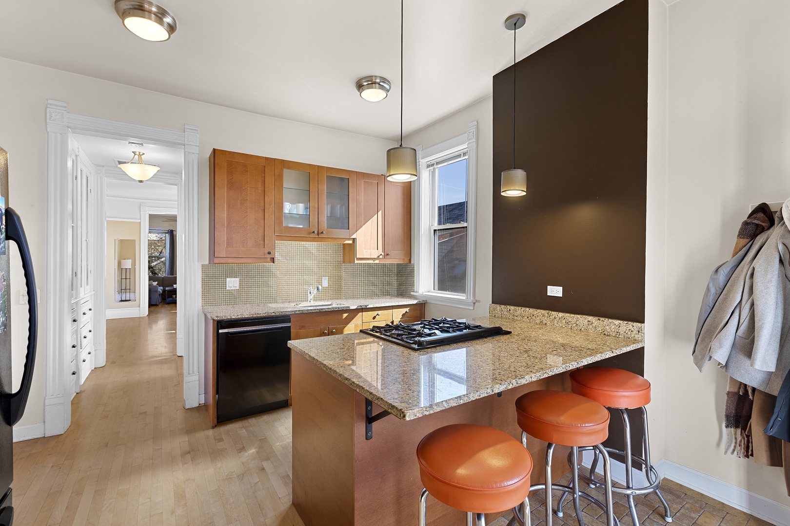 929 West Fletcher Street Chicago, IL 60657 - Photo 46 of 53 a kitchen with stainless steel appliances granite countertop a stove and a refrigerator