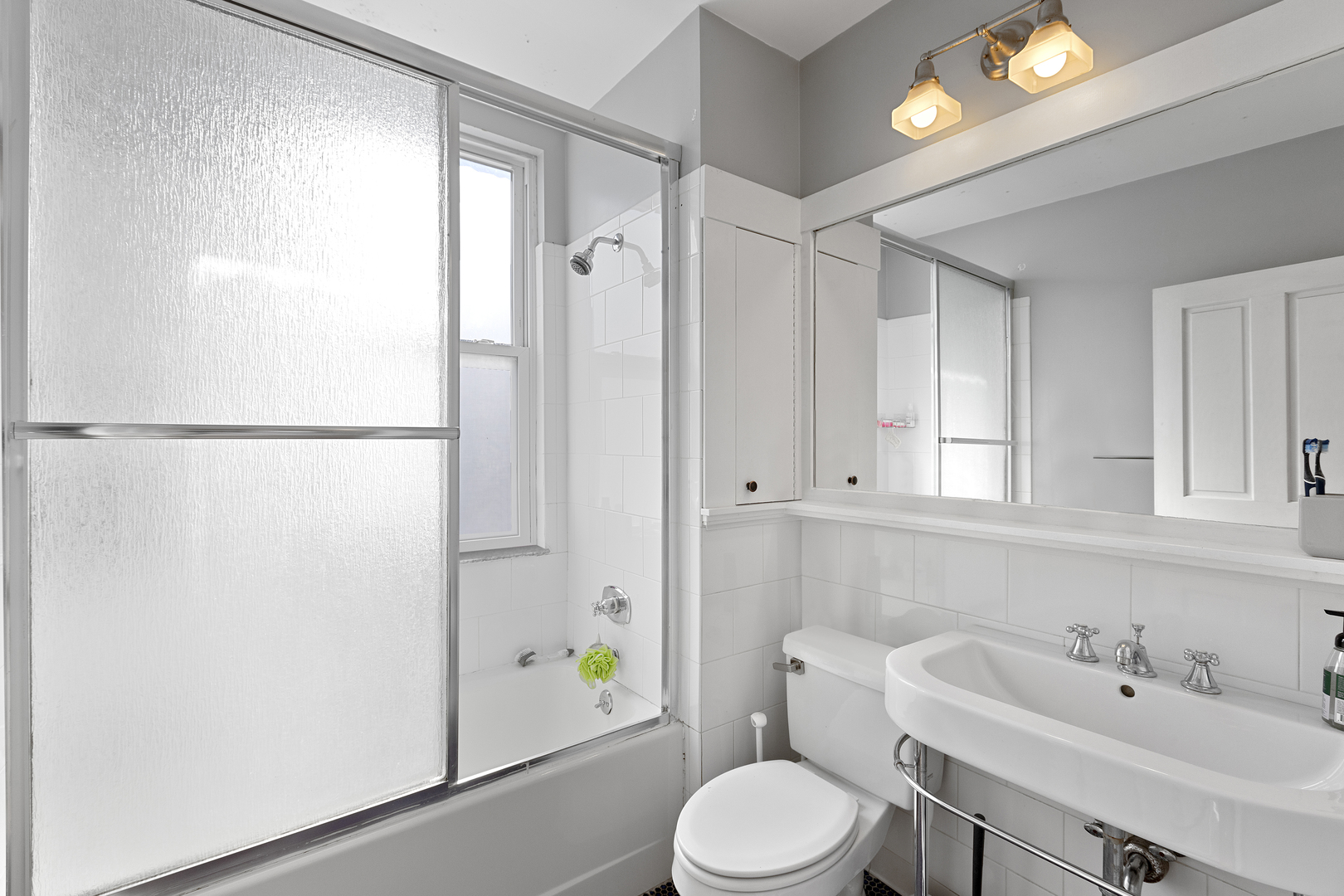 929 West Fletcher Street Chicago, IL 60657 - Photo 48 of 53 a bathroom with a sink toilet and shower