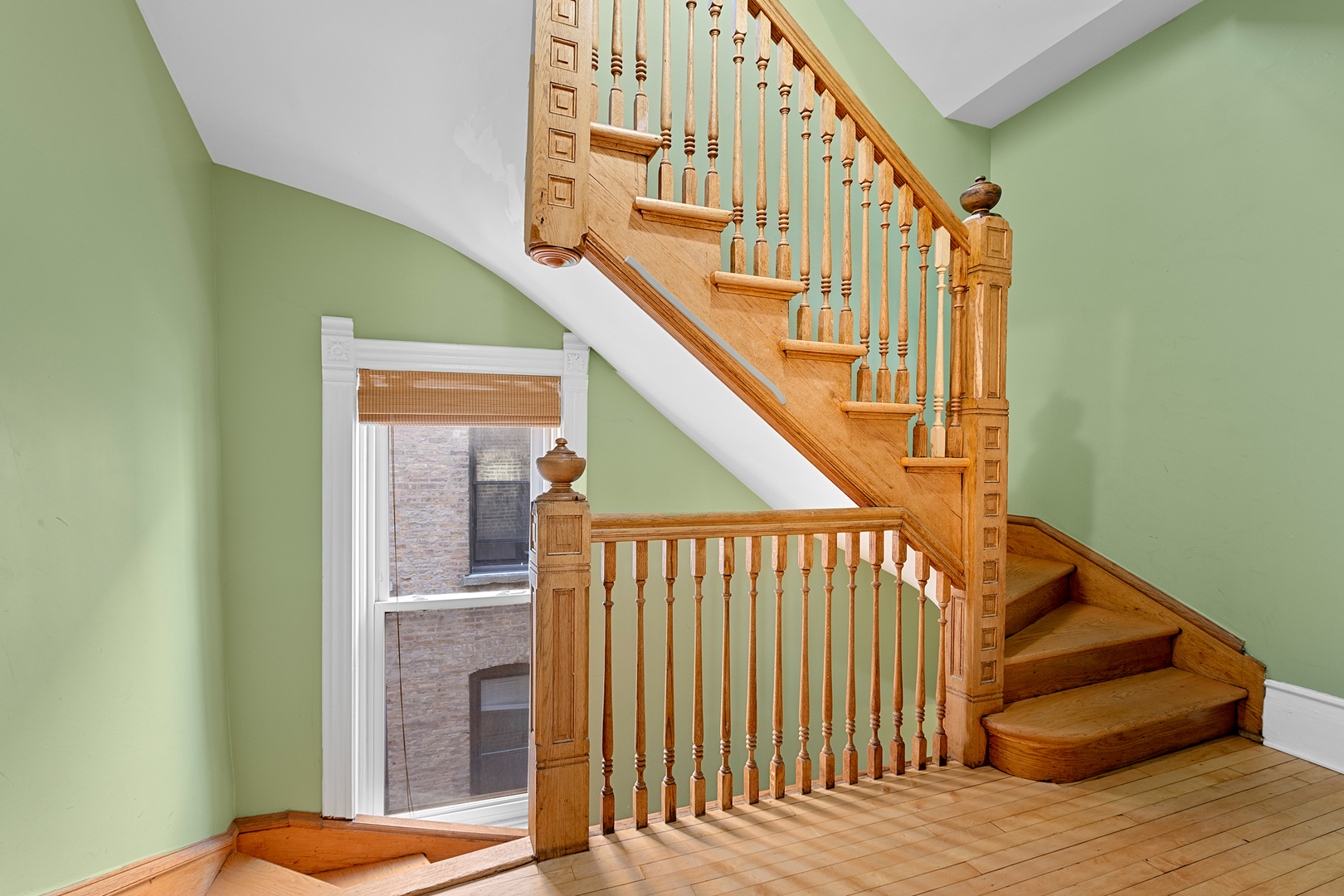 929 West Fletcher Street Chicago, IL 60657 - Photo 50 of 53 a view of staircase with railing and a rug