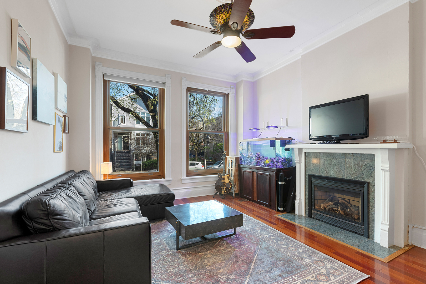 929 West Fletcher Street Chicago, IL 60657 - Photo 7 of 53 a living room with furniture a flat screen tv and a fireplace