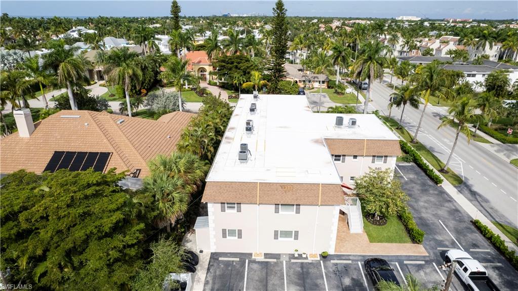 940 3rd Street South, Unit 204 Naples, FL 34102 - Photo 23 of 25 an aerial view of a house with a yard
