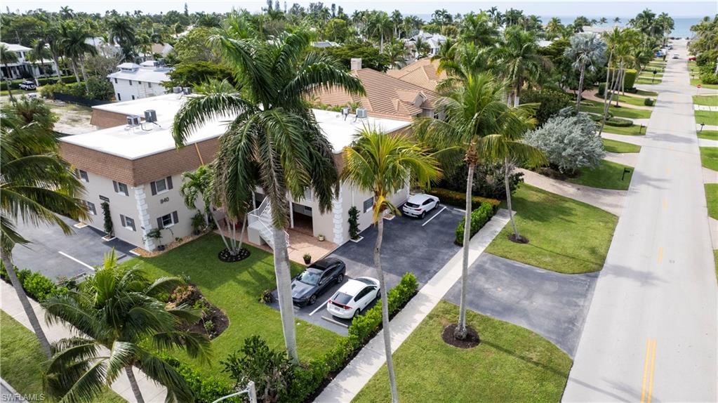 940 3rd Street South, Unit 204 Naples, FL 34102 - Photo 25 of 25 an aerial view of a house with a garden and swimming pool
