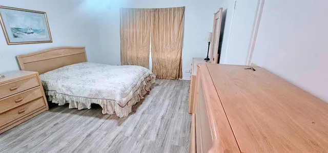 a bedroom with a bed and a table
