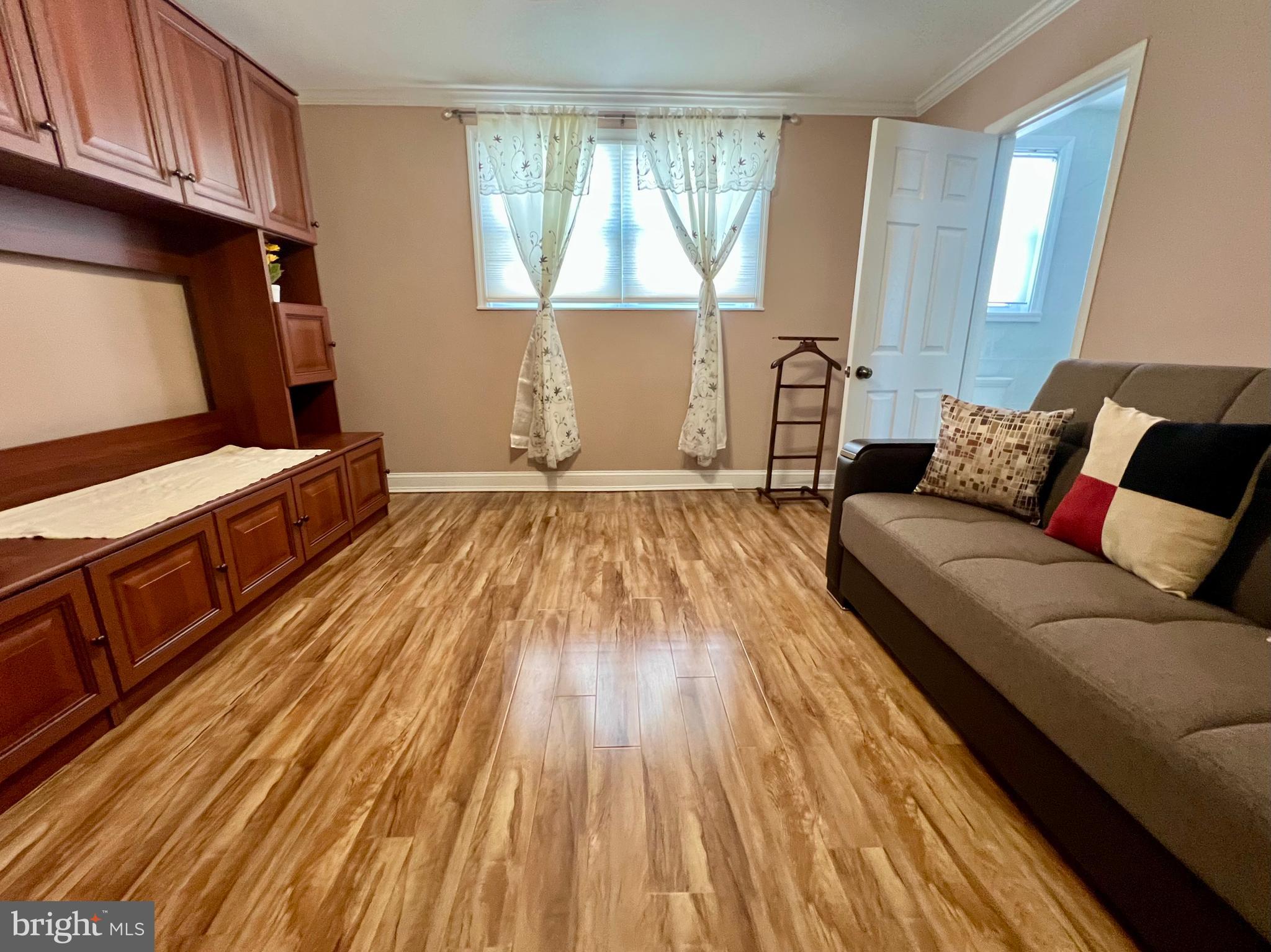 2988 Welsh Road Philadelphia, PA 19152 - Photo 26 of 38 a living room with furniture and a wooden floor