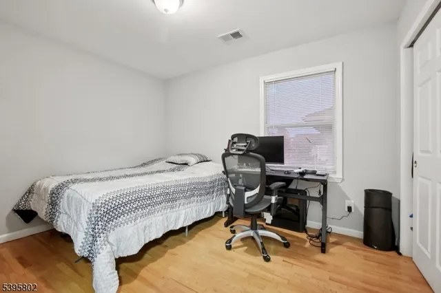 a bedroom with a workspace