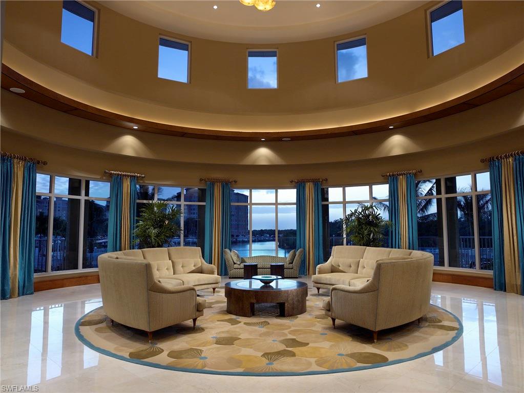 13675 Vanderbilt Drive, Unit 510 Naples, FL 34110 - Photo 14 of 25 a living room with furniture and window