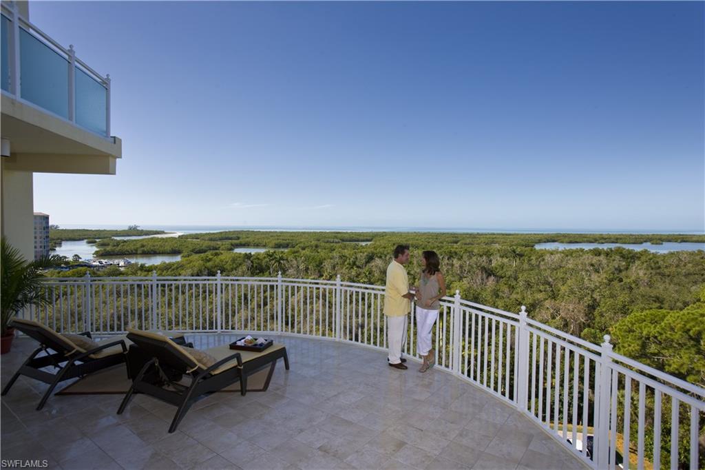 13675 Vanderbilt Drive, Unit 510 Naples, FL 34110 - Photo 19 of 25 a view of a city from a balcony with outdoor space