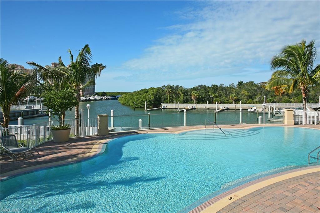 13675 Vanderbilt Drive, Unit 510 Naples, FL 34110 - Photo 23 of 25 a view of a house with a yard