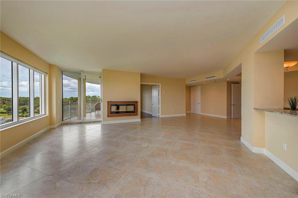 13675 Vanderbilt Drive, Unit 510 Naples, FL 34110 - Photo 4 of 25 a view of an empty room with a window