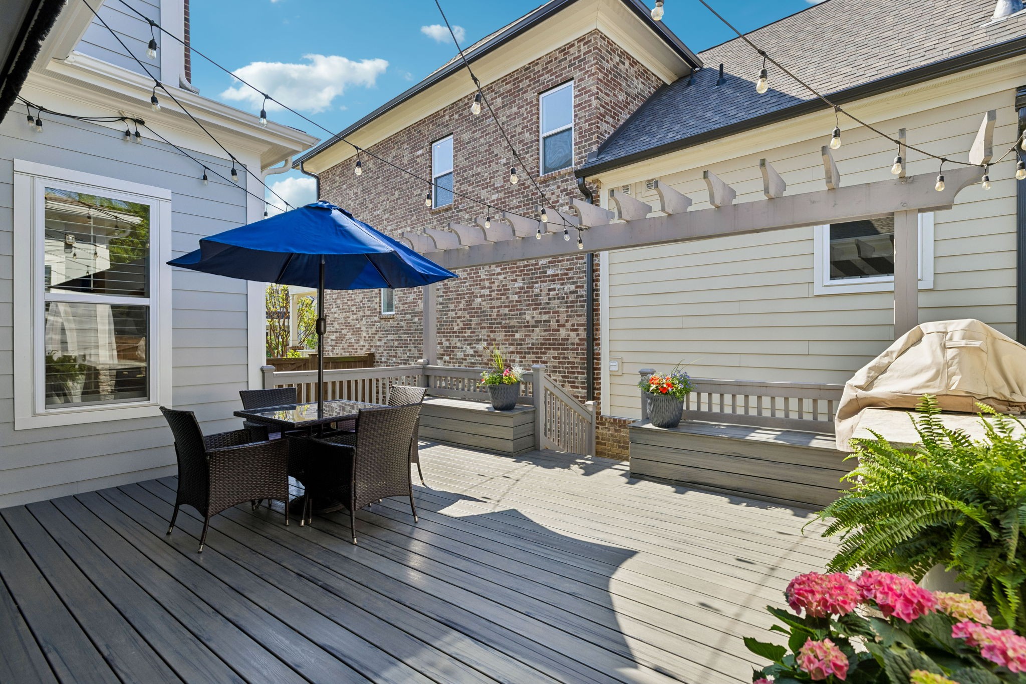 8024 Keats Street Franklin, TN 37064 - Photo 17 of 42 a view of a tables and chairs on the roof deck
