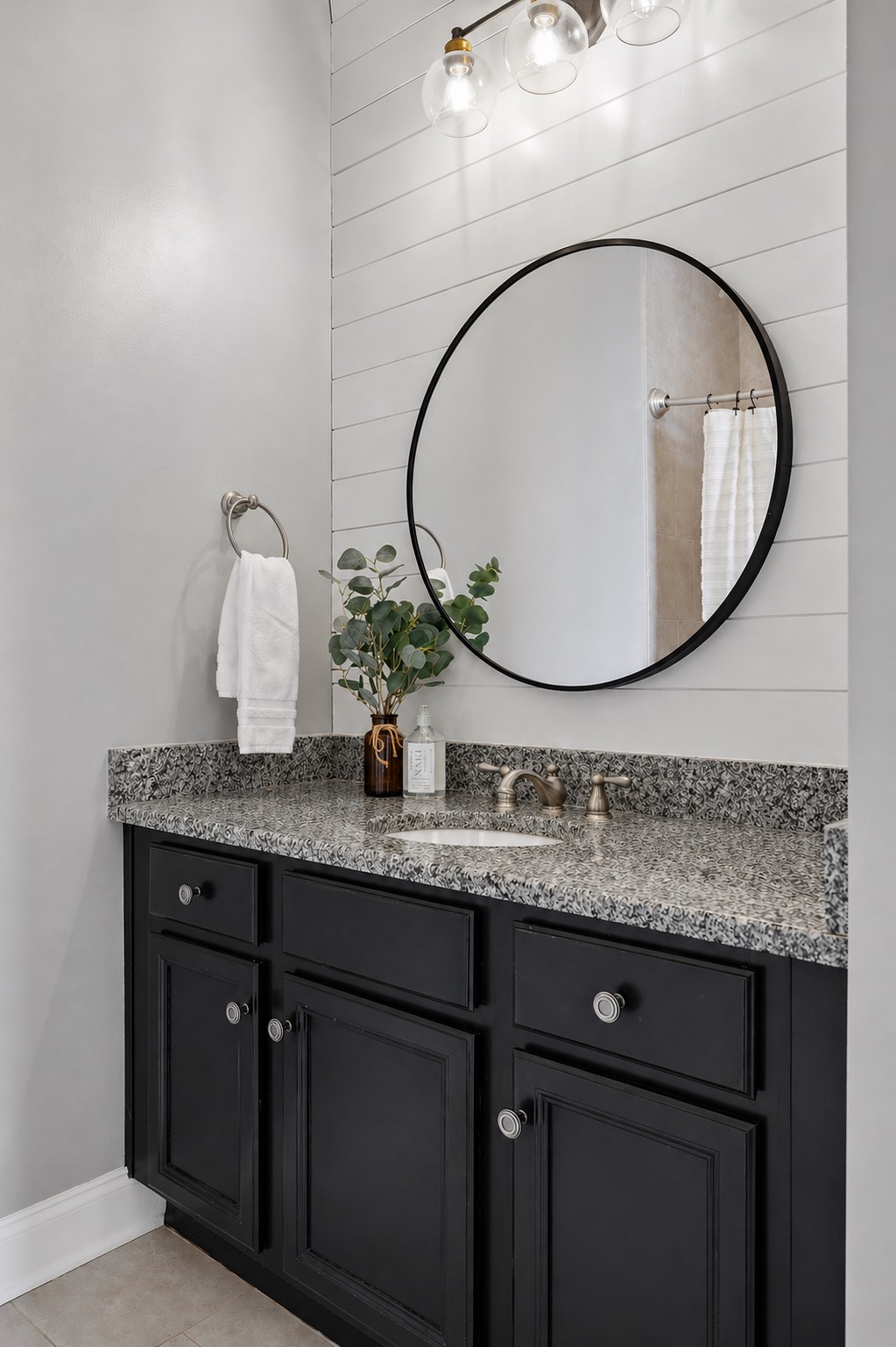 8024 Keats Street Franklin, TN 37064 - Photo 27 of 42 a bathroom with a granite countertop toilet a sink and a mirror