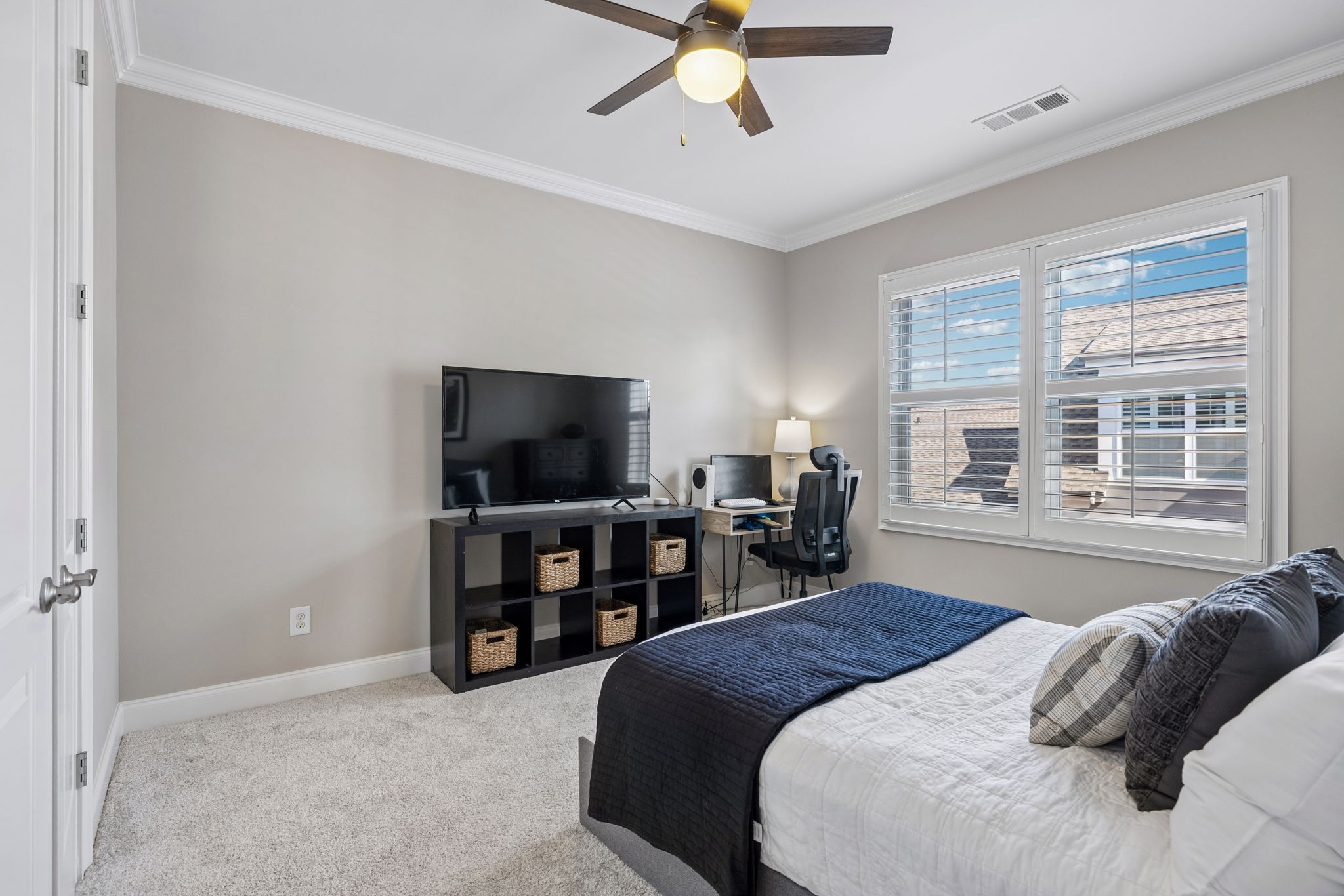 8024 Keats Street Franklin, TN 37064 - Photo 32 of 42 a spacious bedroom with a bed and a flat screen tv
