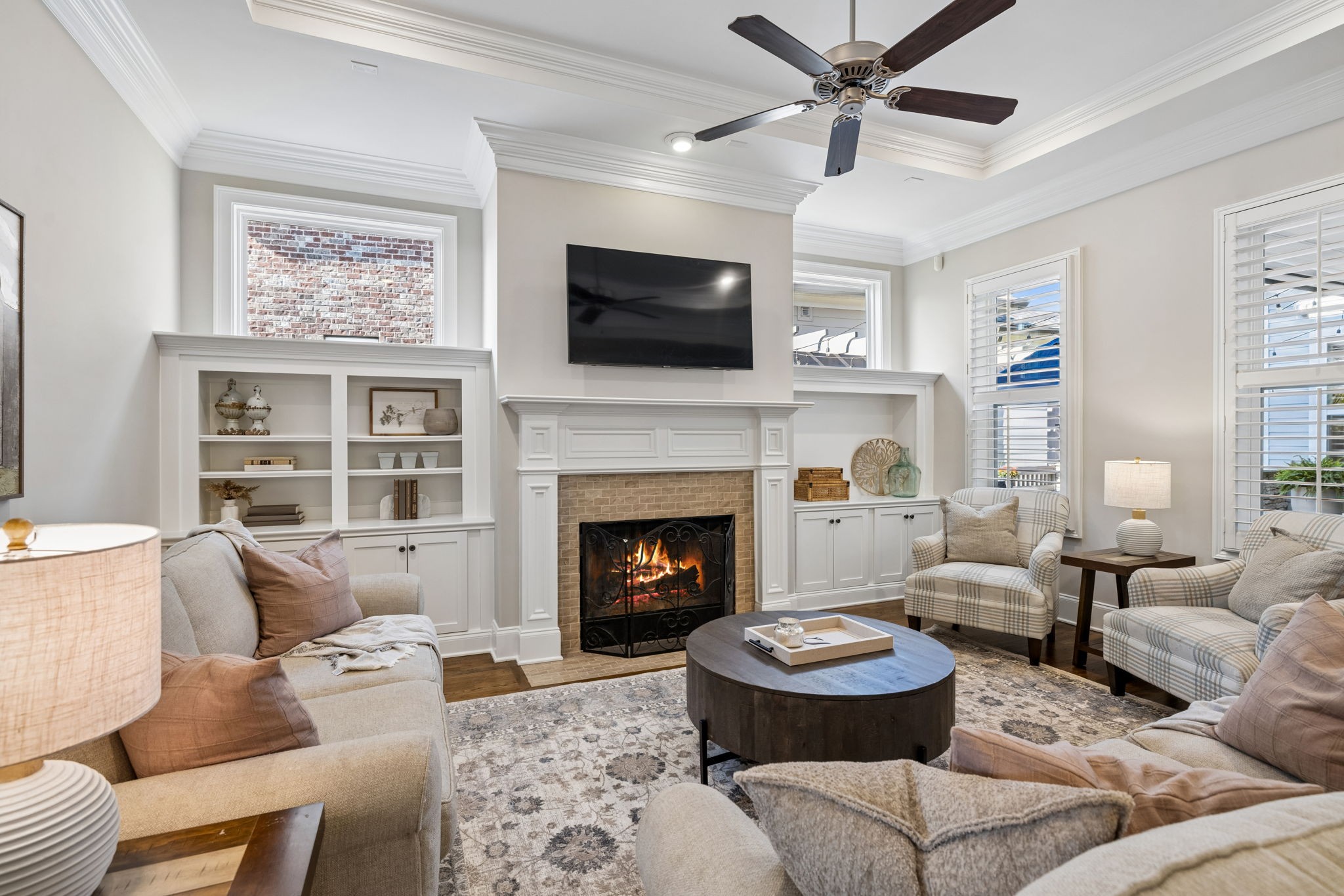 8024 Keats Street Franklin, TN 37064 - Photo 35 of 42 a living room with furniture a flat screen tv and a fireplace