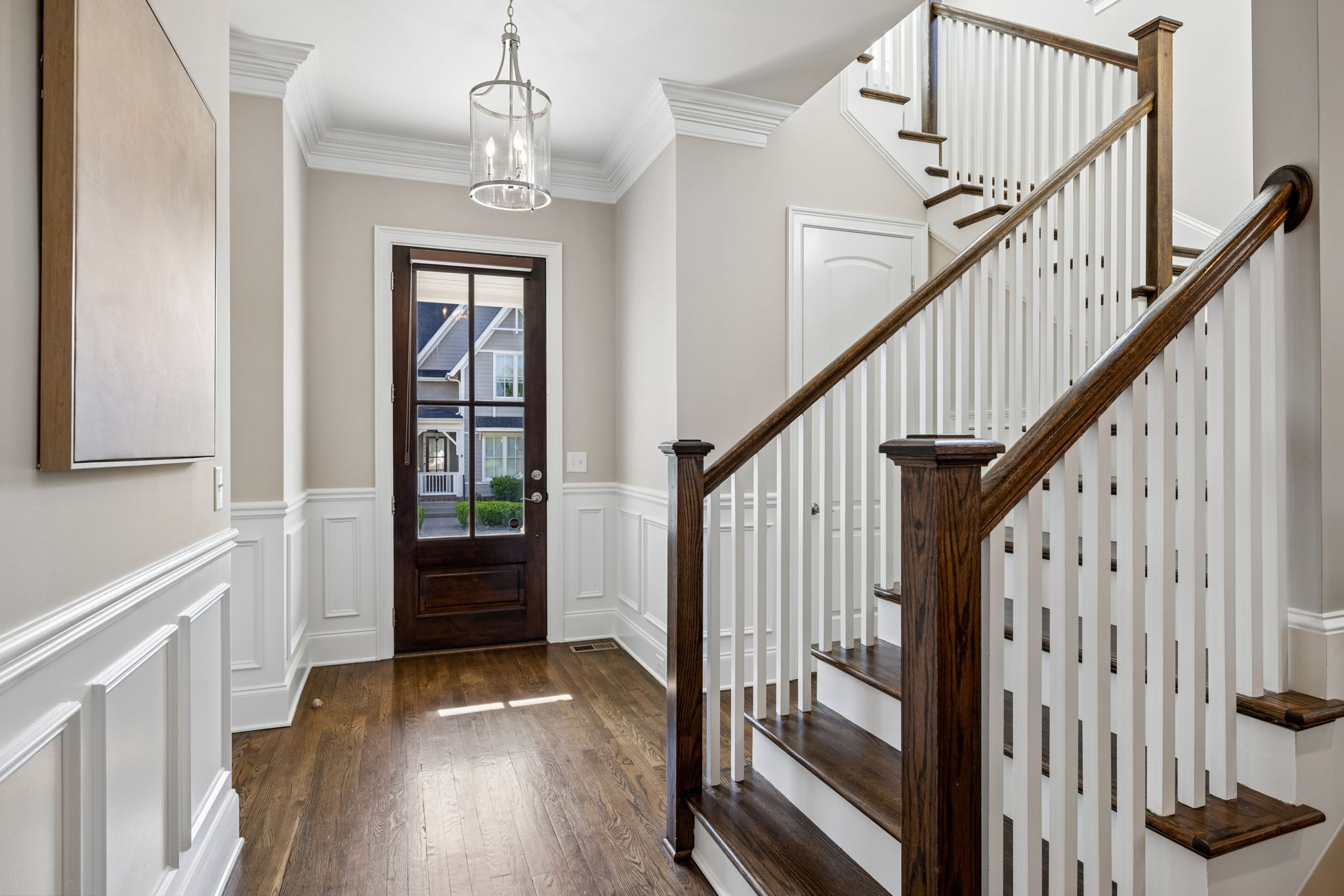 8024 Keats Street Franklin, TN 37064 - Photo 6 of 42 a view of an entryway with wooden floor and stairs