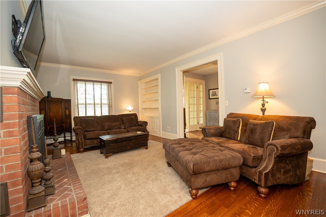 10775 Main Street Clarence, NY 14031 - Photo 21 of 50 Living room Built in bookcase