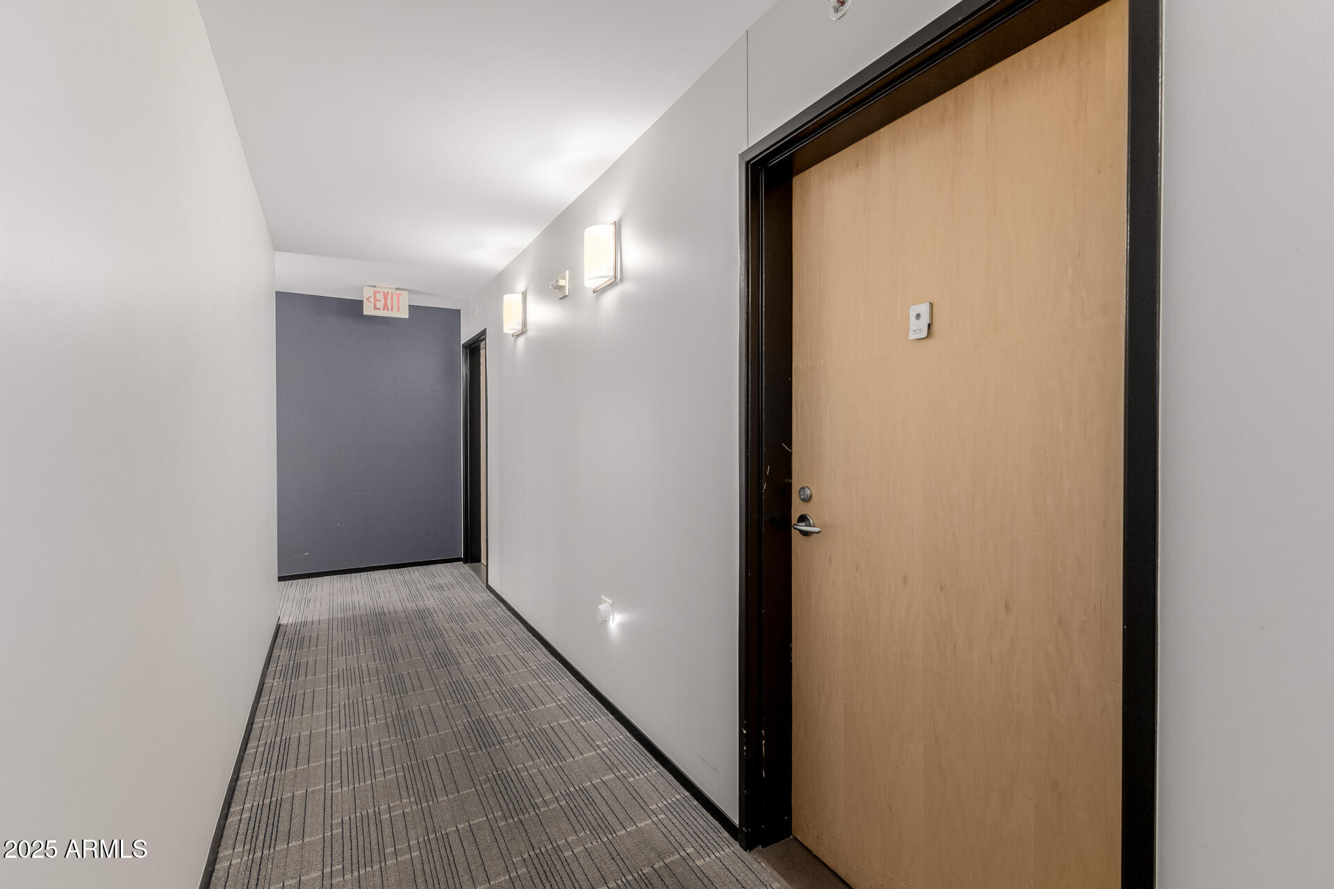 a view of hallway with wooden floor