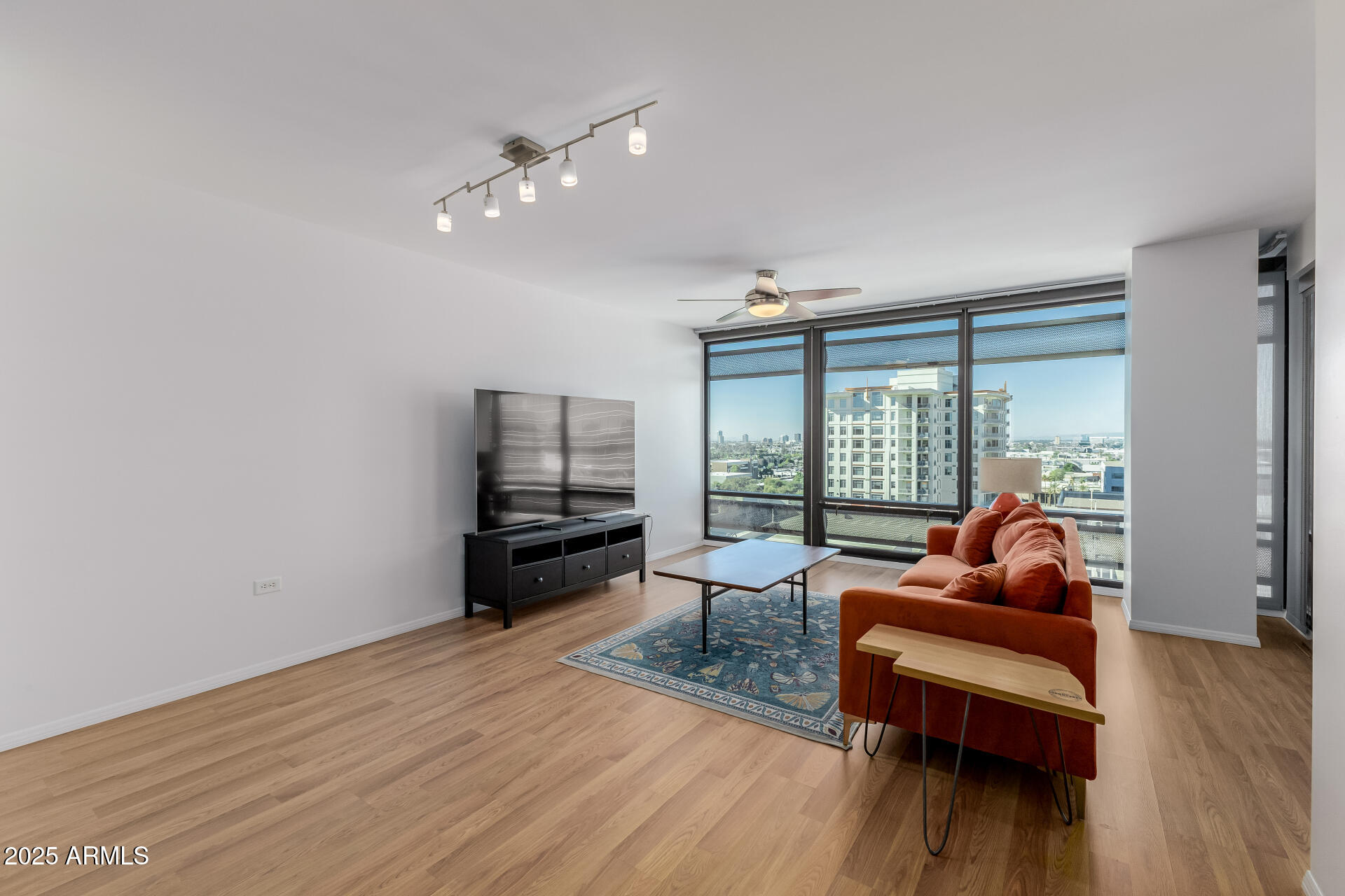 4808 North 24th Street, Unit 1125 Phoenix, AZ 85016 - Photo 11 of 67 a living room with furniture and wooden floor