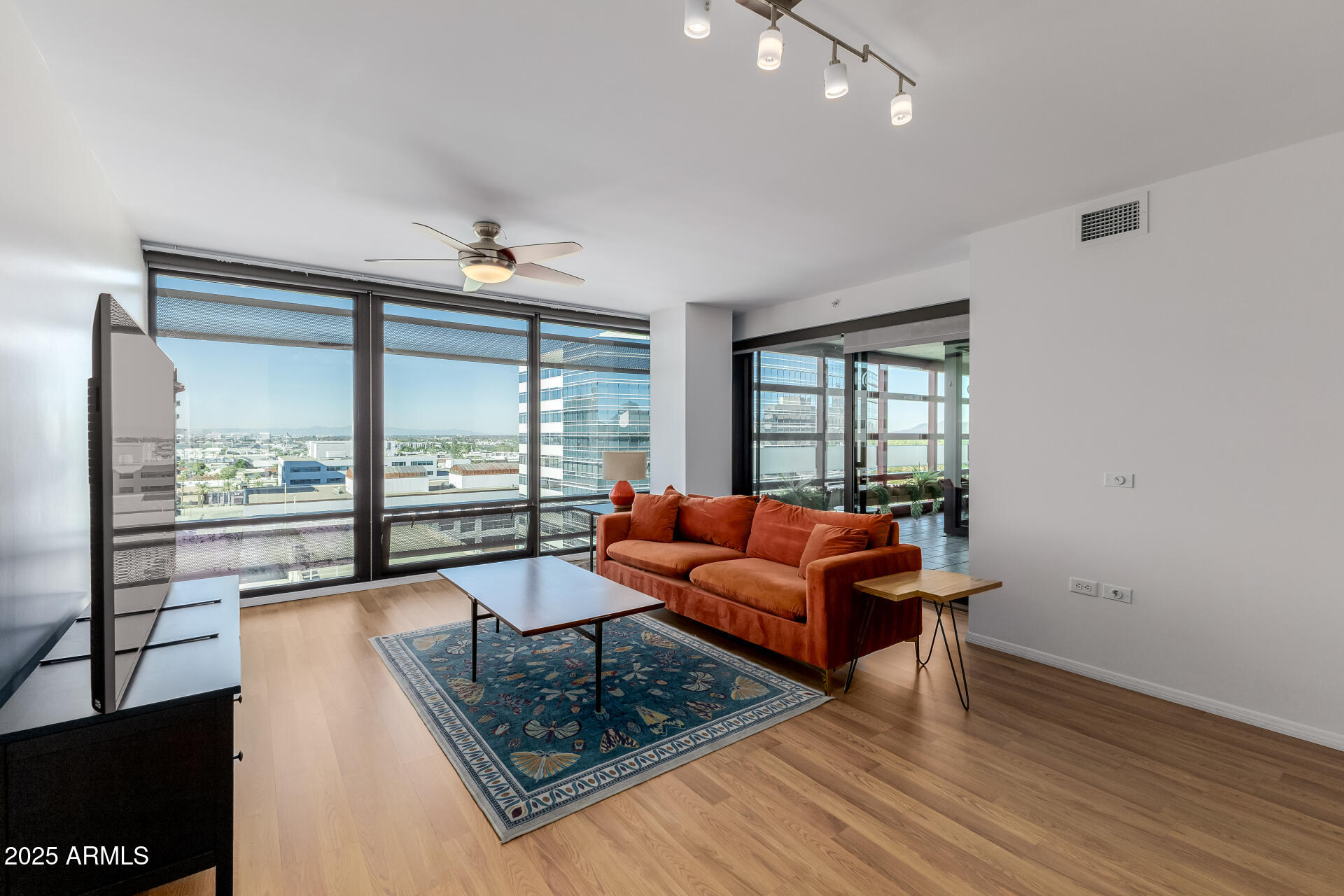 4808 North 24th Street, Unit 1125 Phoenix, AZ 85016 - Photo 12 of 67 a living room with furniture and a large window