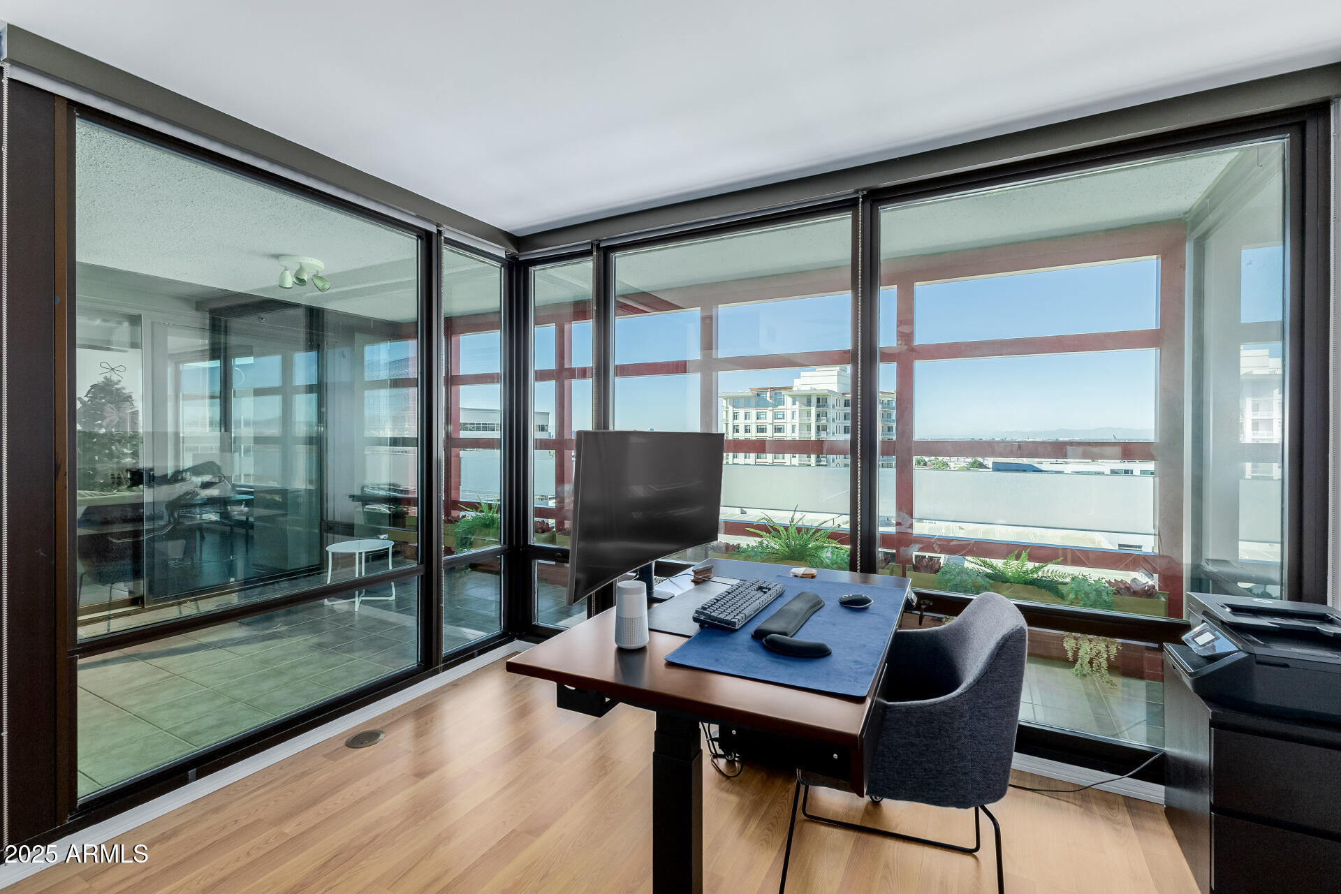 4808 North 24th Street, Unit 1125 Phoenix, AZ 85016 - Photo 15 of 67 a view of a workspace with furniture and a window