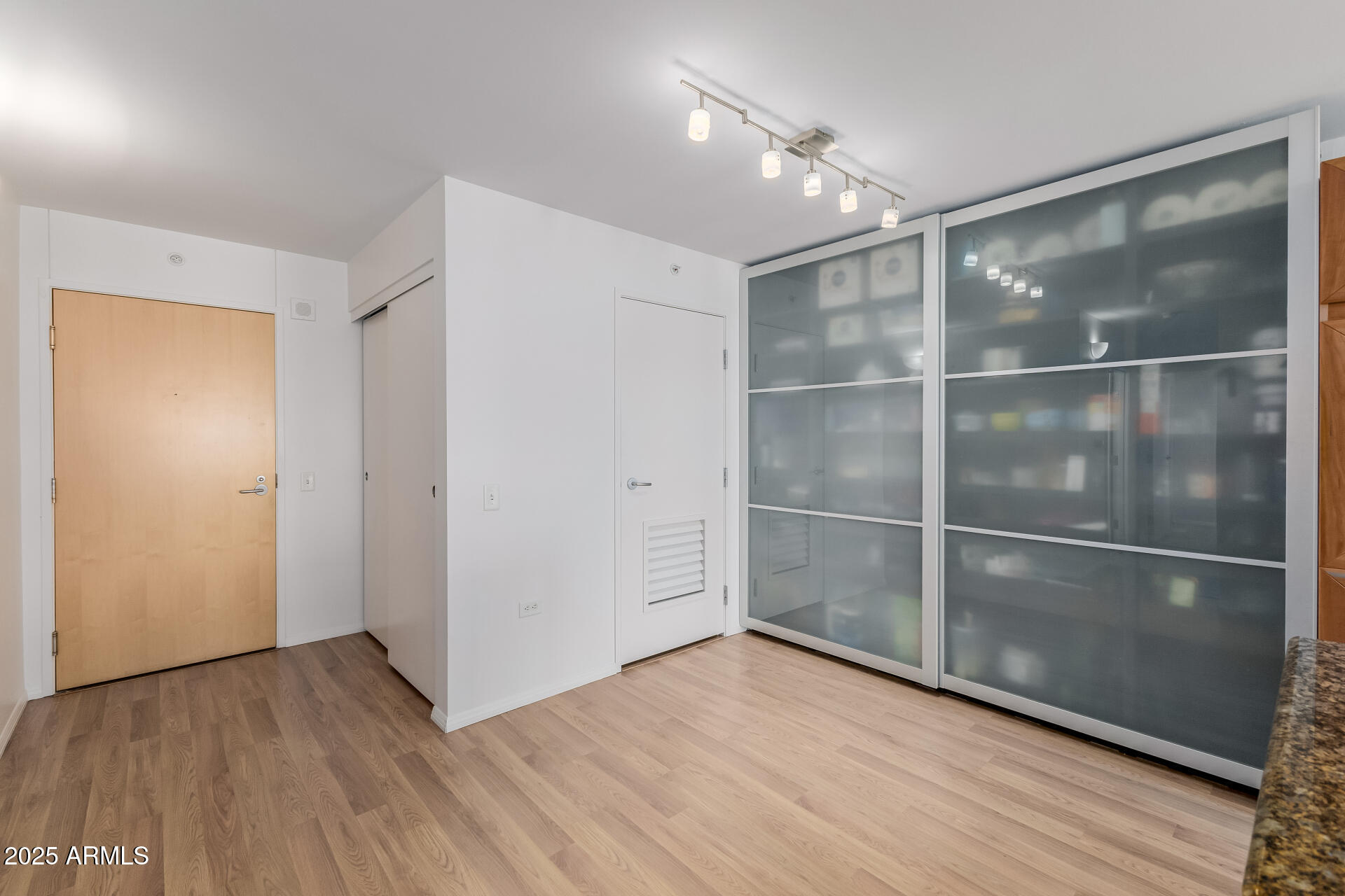 4808 North 24th Street, Unit 1125 Phoenix, AZ 85016 - Photo 2 of 67 a view of an empty room with wooden floor and a window