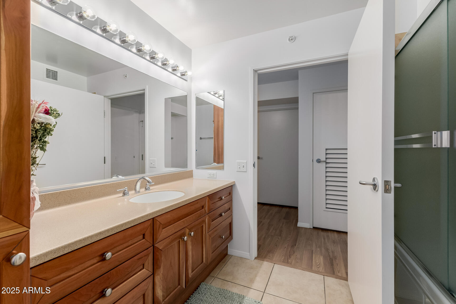 4808 North 24th Street, Unit 1125 Phoenix, AZ 85016 - Photo 26 of 67 a spacious bathroom with a double vanity sink and a mirror