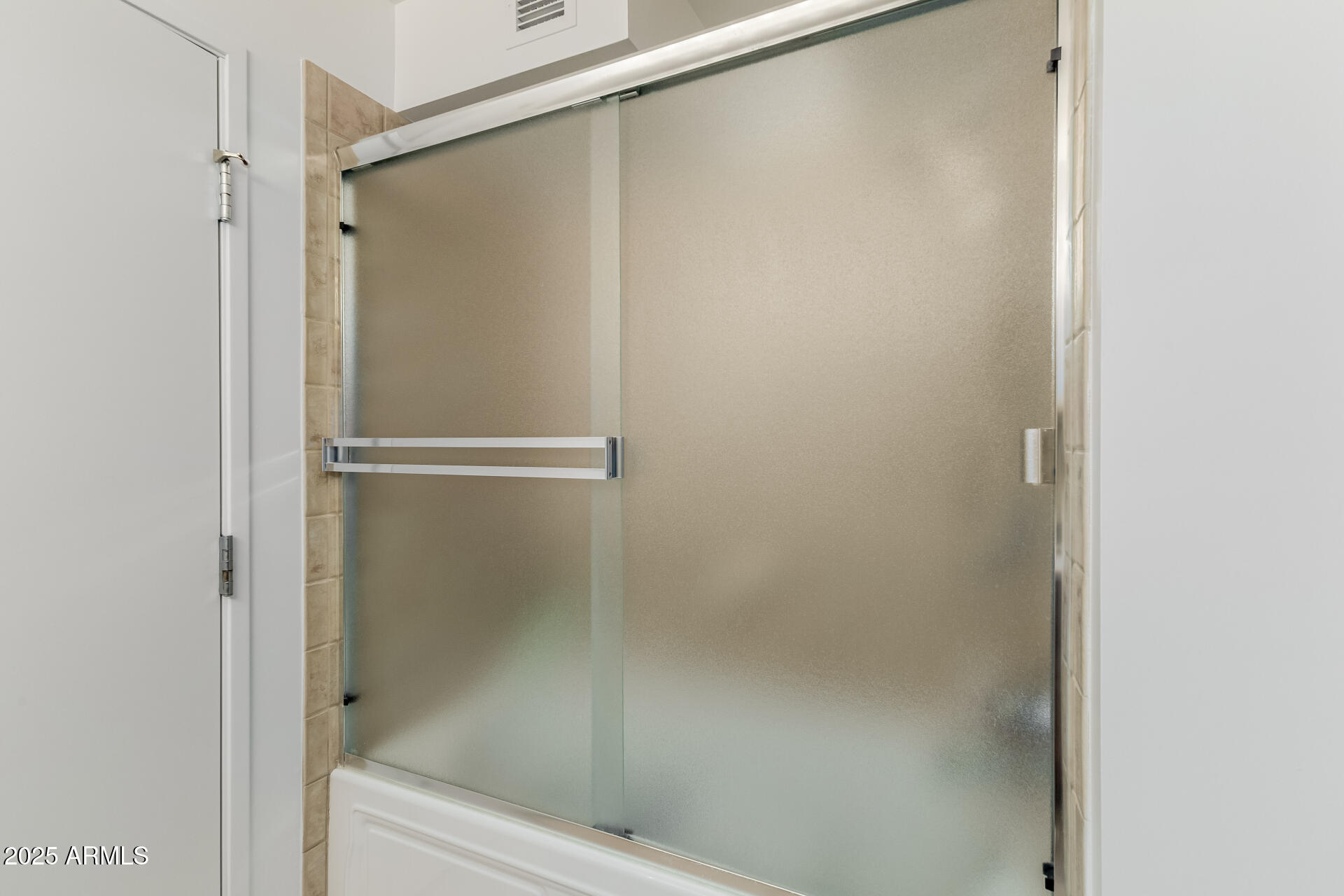 4808 North 24th Street, Unit 1125 Phoenix, AZ 85016 - Photo 27 of 67 a bathroom with a glass shower door