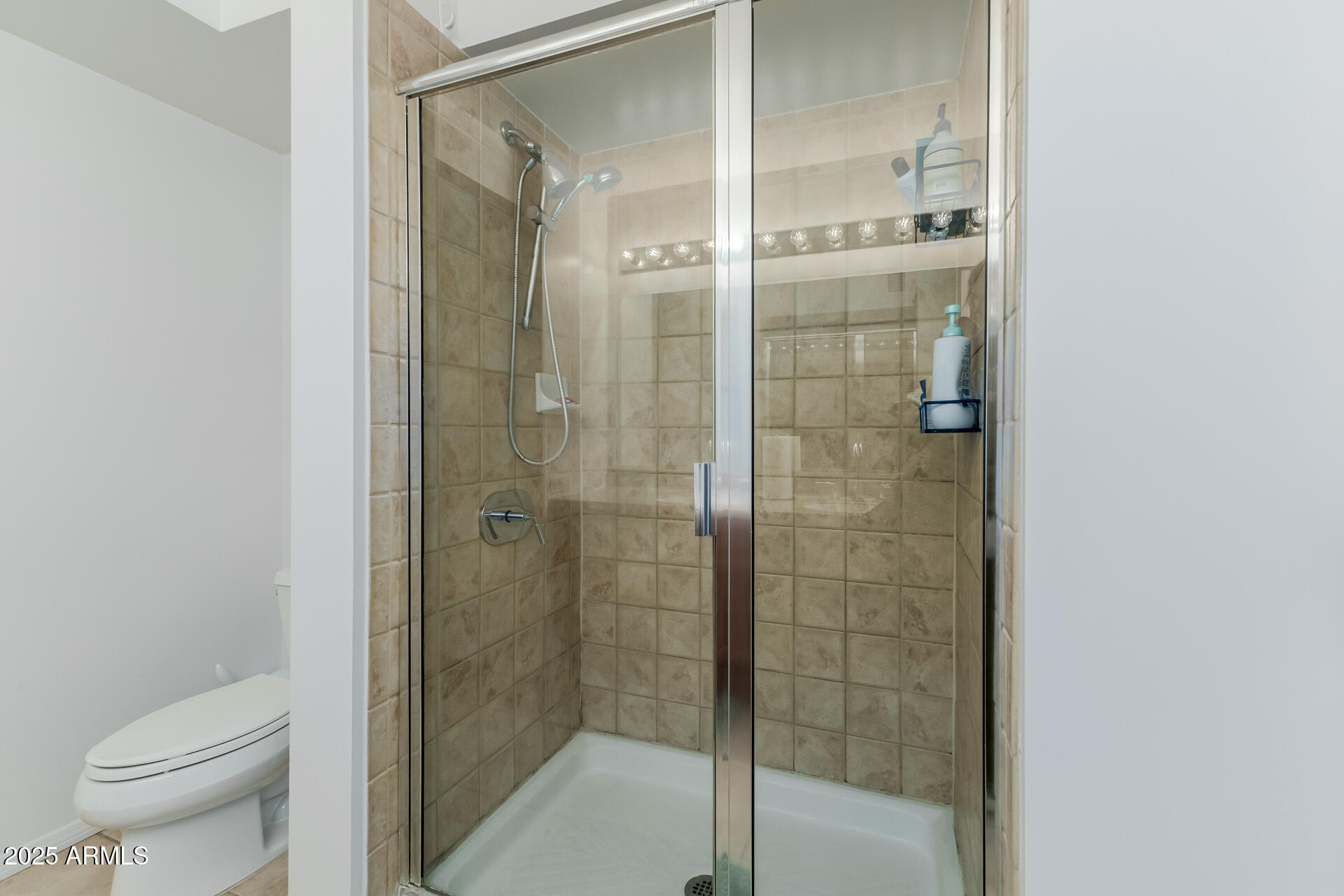 4808 North 24th Street, Unit 1125 Phoenix, AZ 85016 - Photo 33 of 67 a bathroom with a shower and a toilet