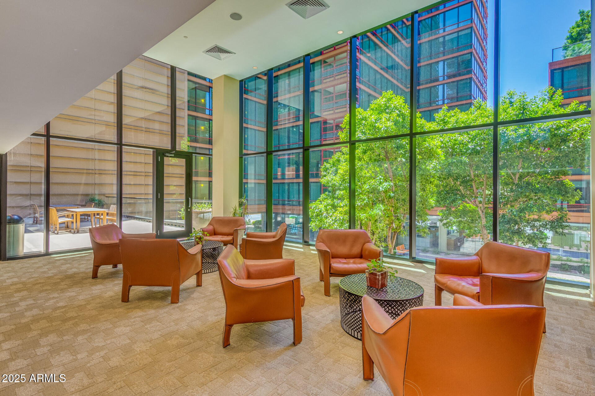 4808 North 24th Street, Unit 1125 Phoenix, AZ 85016 - Photo 38 of 67 a living room with furniture and a floor to ceiling window