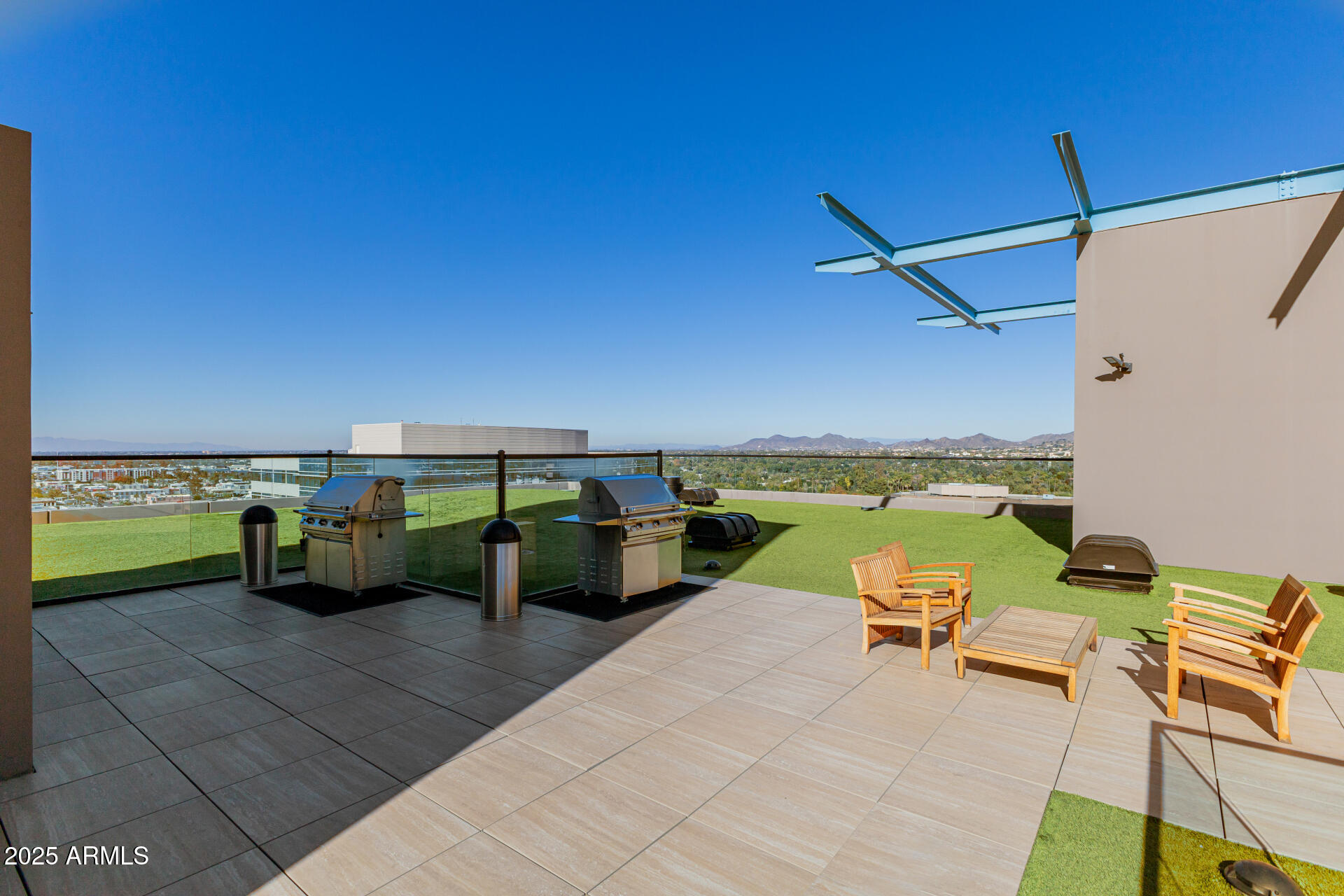 4808 North 24th Street, Unit 1125 Phoenix, AZ 85016 - Photo 49 of 67 a view of swimming pool with seating area and roof