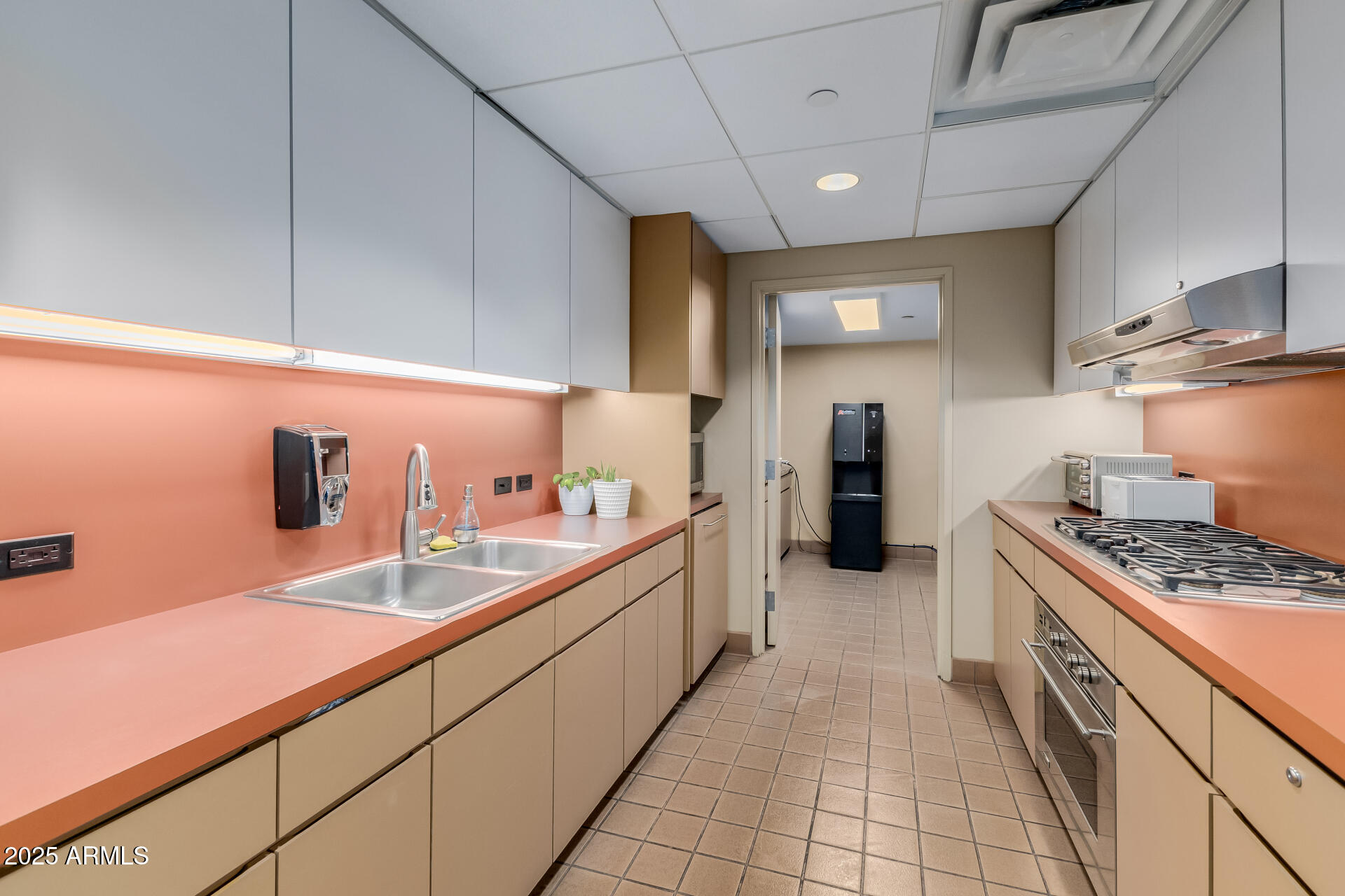 4808 North 24th Street, Unit 1125 Phoenix, AZ 85016 - Photo 54 of 67 a kitchen with a sink and cabinets
