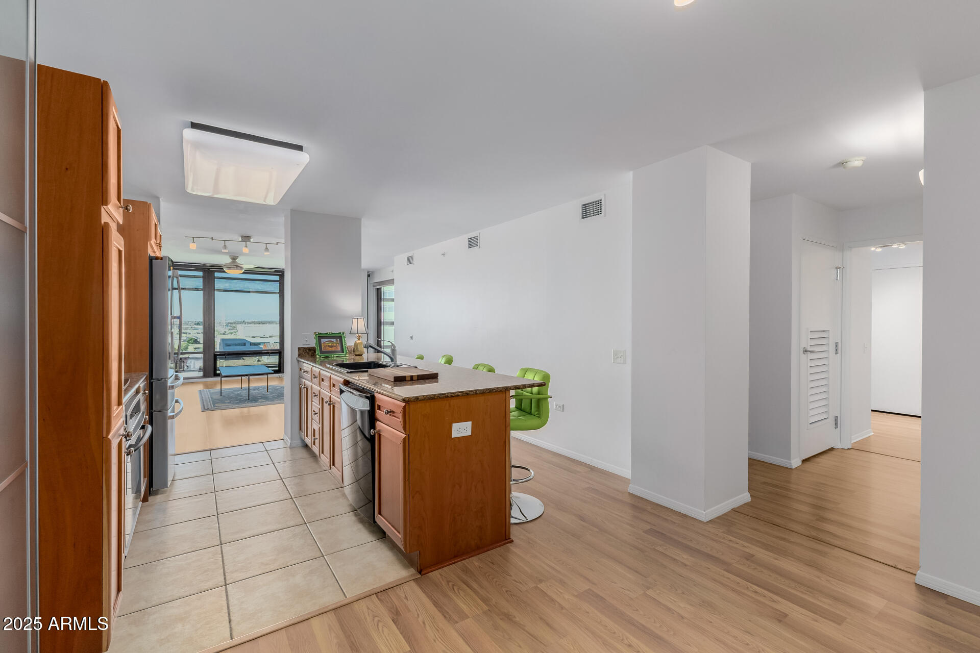 4808 North 24th Street, Unit 1125 Phoenix, AZ 85016 - Photo 9 of 67 a kitchen with stainless steel appliances granite countertop a stove and a refrigerator