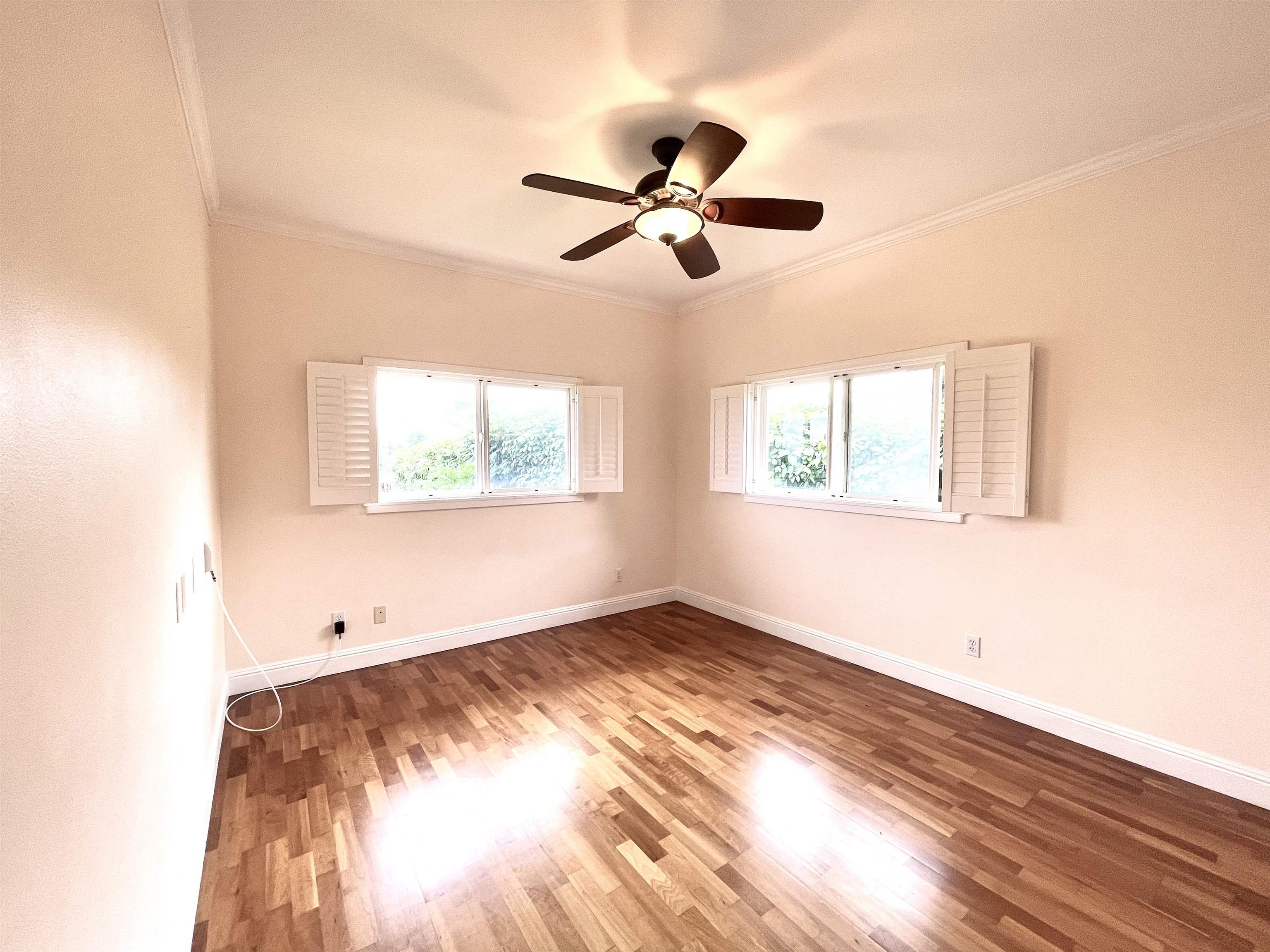 22 Hale Lio Place Haiku, HI 96708 - Photo 20 of 50 a view of empty room with wooden floor and fan