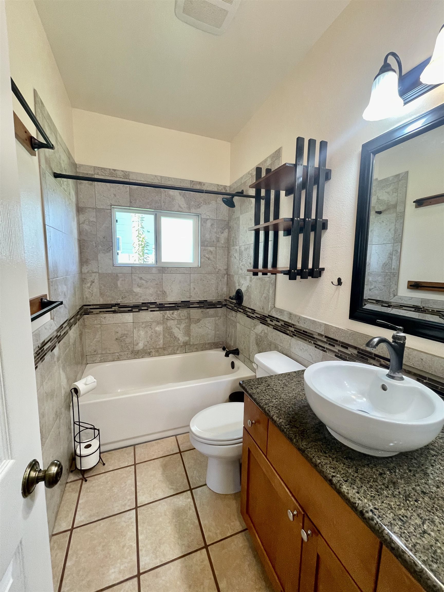 22 Hale Lio Place Haiku, HI 96708 - Photo 35 of 50 a bathroom with a granite countertop sink mirror vanity bathtub and a toilet