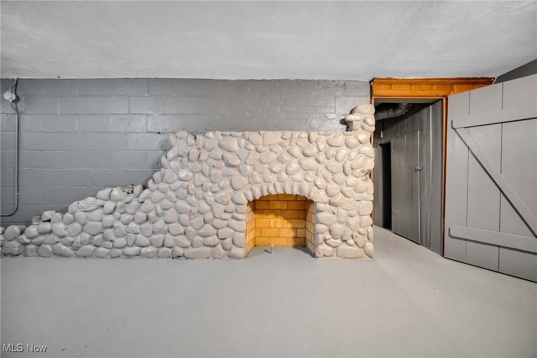 1605 Laclede Road Cleveland, OH 44121 - Photo 31 of 40 Interior details with concrete flooring and concrete block wall