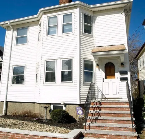 a front view of a house with a window