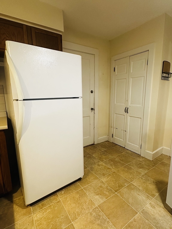 21 Prescott Street, Unit 1 Winthrop, MA 02152 - Photo 18 of 20 a white refrigerator freezer and a dishwasher