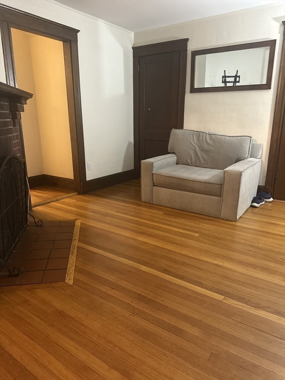 21 Prescott Street, Unit 1 Winthrop, MA 02152 - Photo 2 of 20 a living room with furniture and a flat screen tv