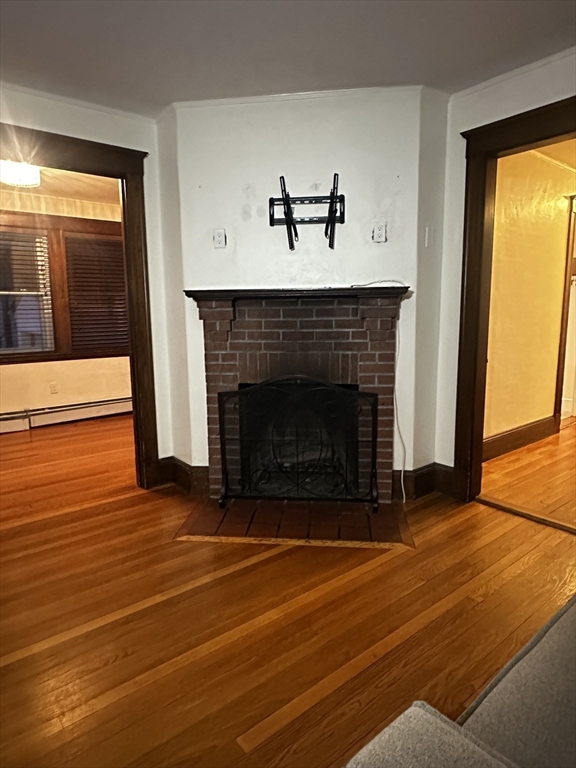 21 Prescott Street, Unit 1 Winthrop, MA 02152 - Photo 3 of 20 a living room with furniture and a fireplace