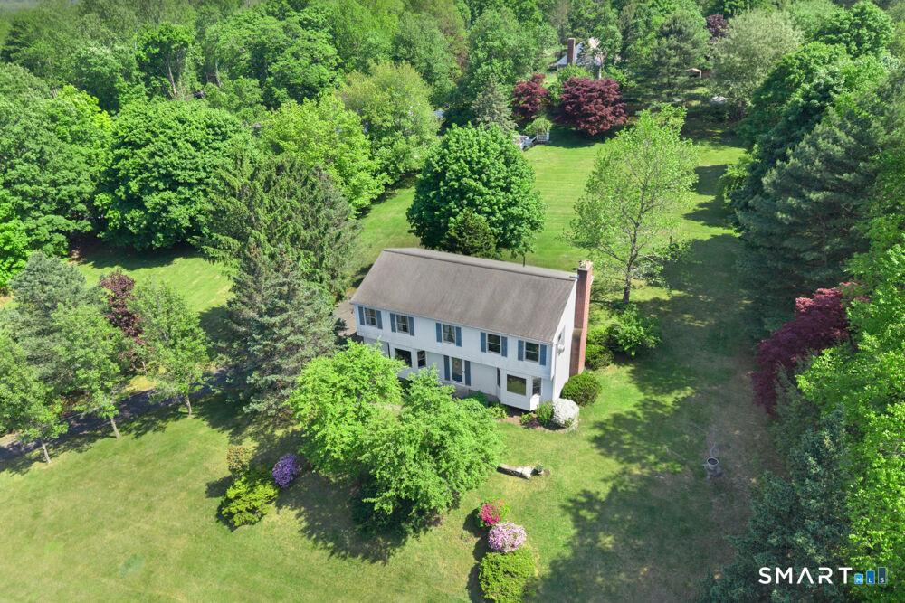 1 Red Barn Road Oxford, CT 06478 - Photo 1 of 40 an aerial view of residential house with outdoor space and trees all around