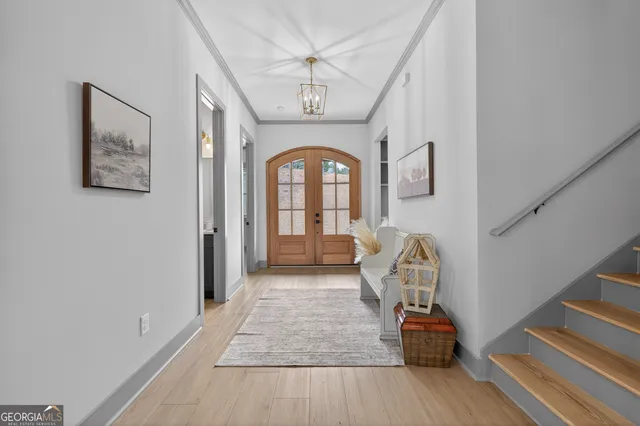 an empty room with ceiling fan and window