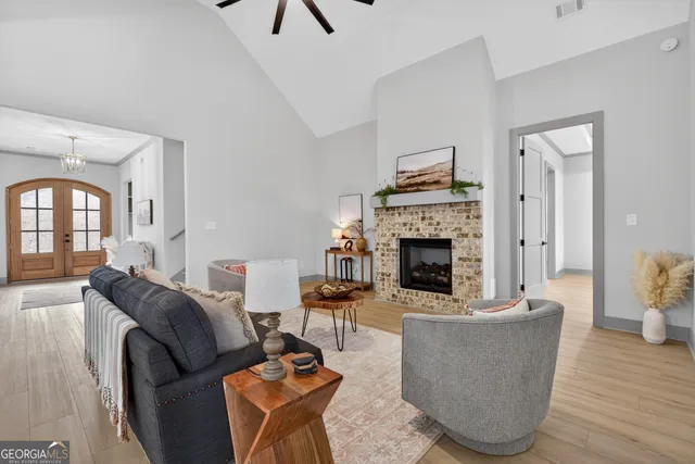 a view of a big room with a ceiling fan