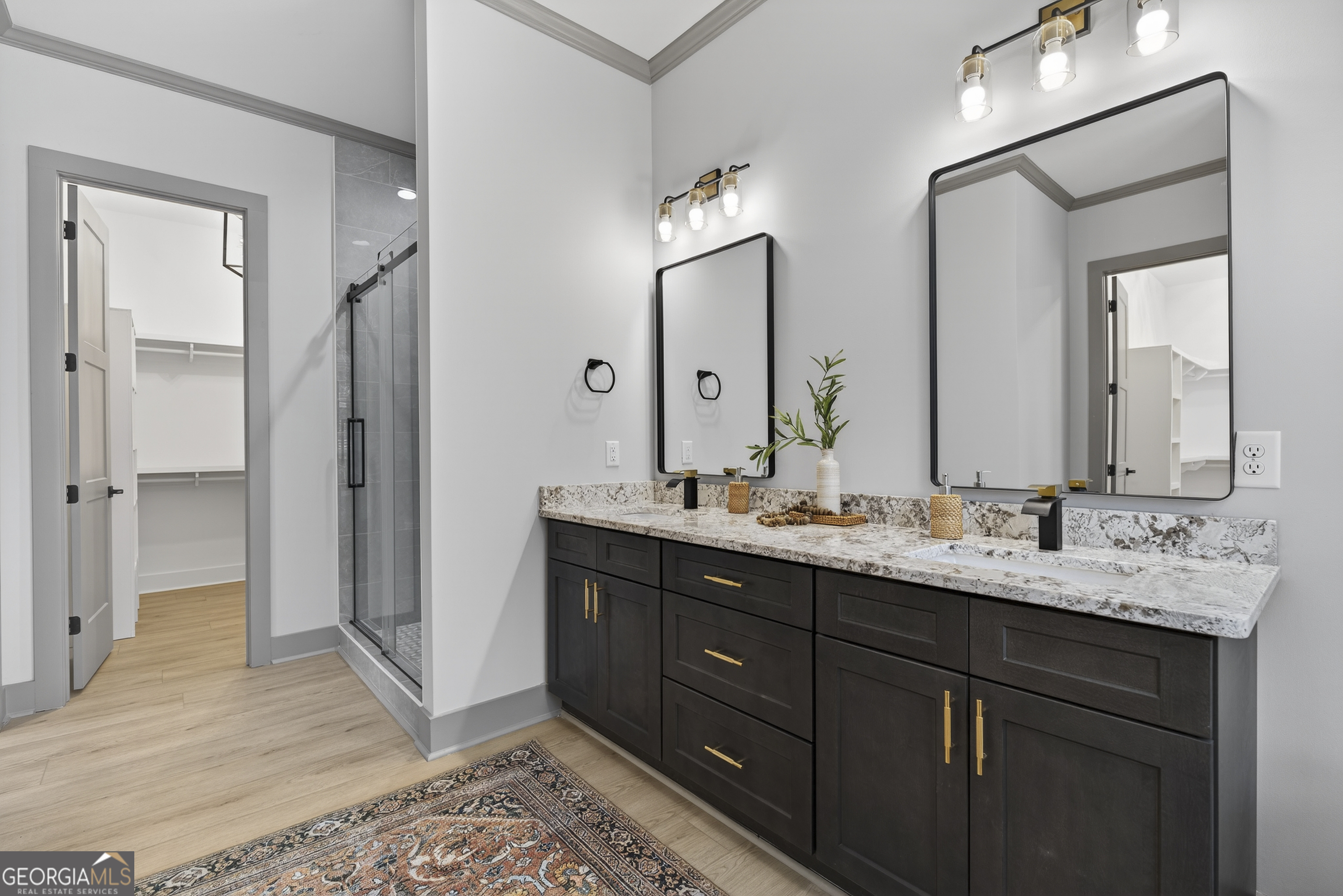 303 Tumbling Shoals Court Gray, GA 31032 - Photo 42 of 86 a bathroom with a double vanity sink and a mirror