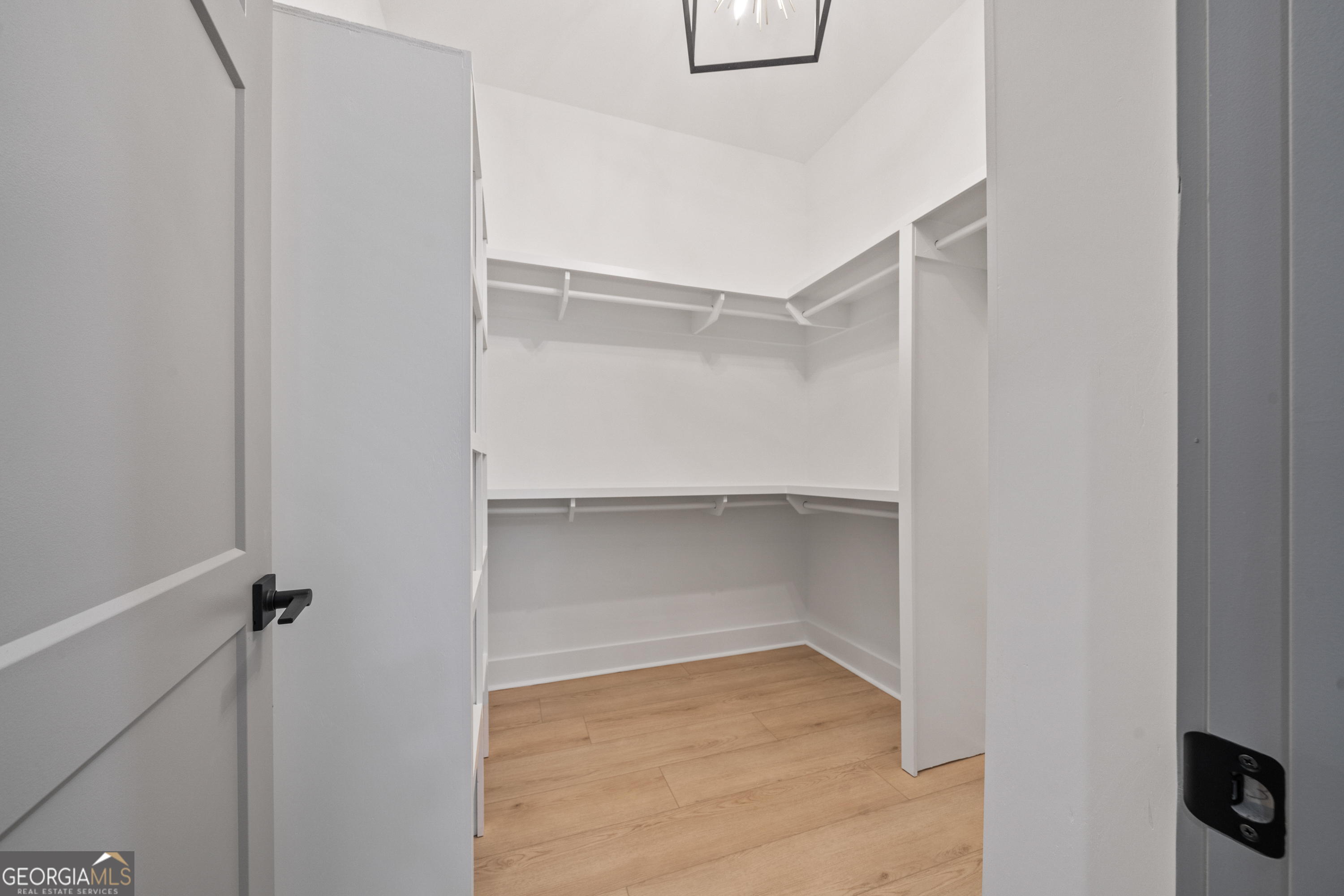 303 Tumbling Shoals Court Gray, GA 31032 - Photo 46 of 86 a view of an empty walk in closet