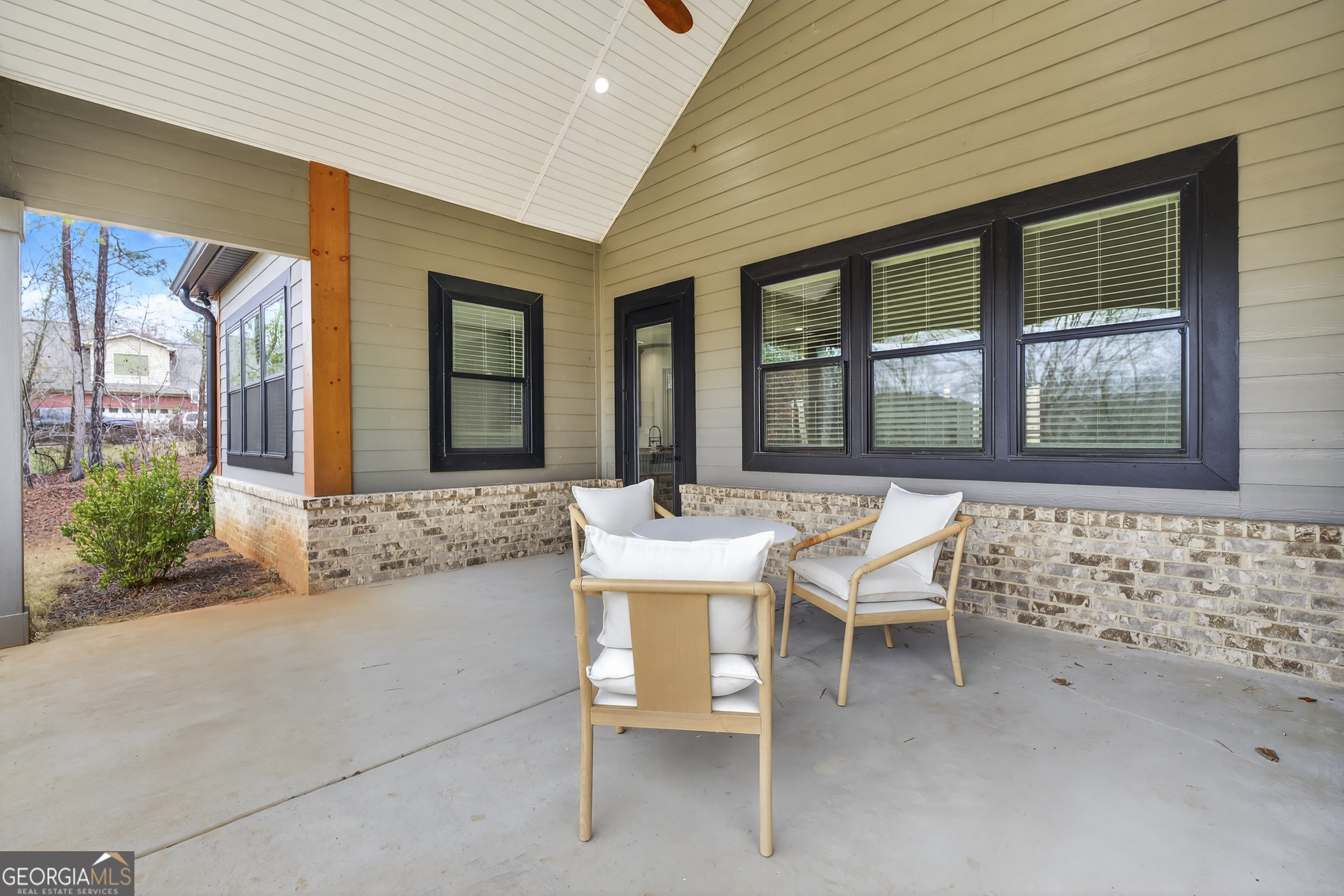 303 Tumbling Shoals Court Gray, GA 31032 - Photo 51 of 86 a balcony with table and chairs