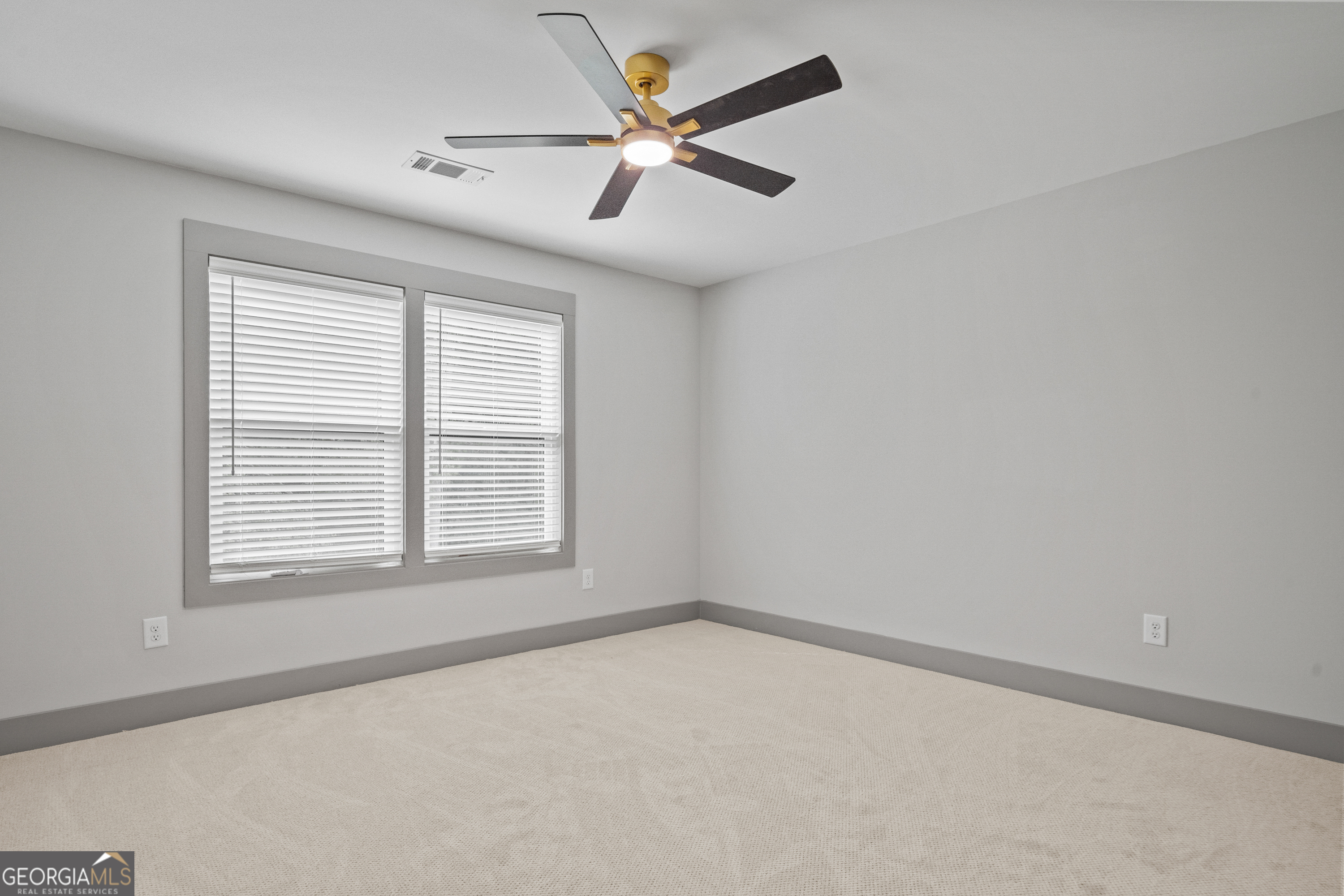 303 Tumbling Shoals Court Gray, GA 31032 - Photo 60 of 86 an empty room with a window and a fan