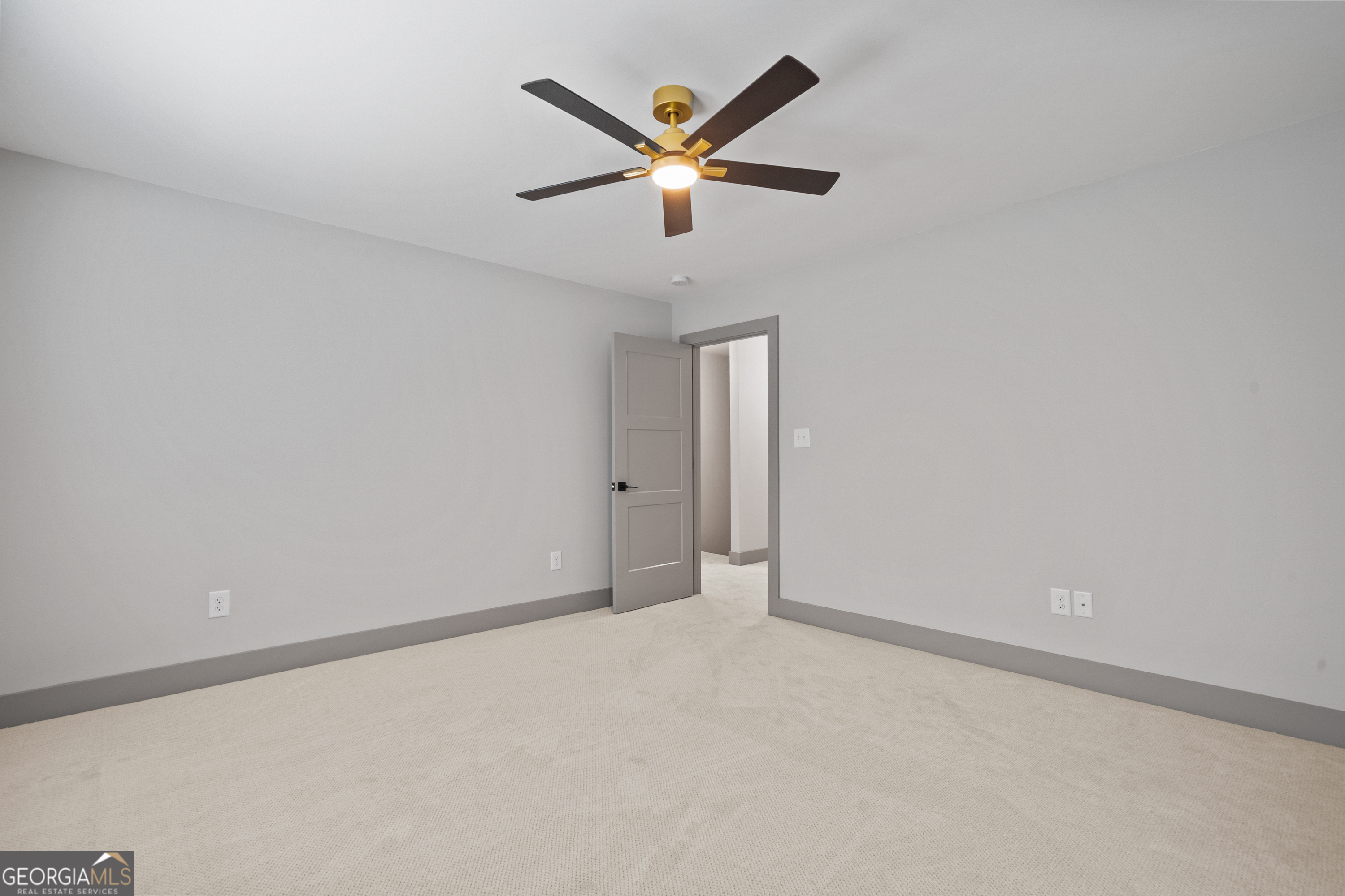 303 Tumbling Shoals Court Gray, GA 31032 - Photo 63 of 86 an empty room with ceiling fan and window