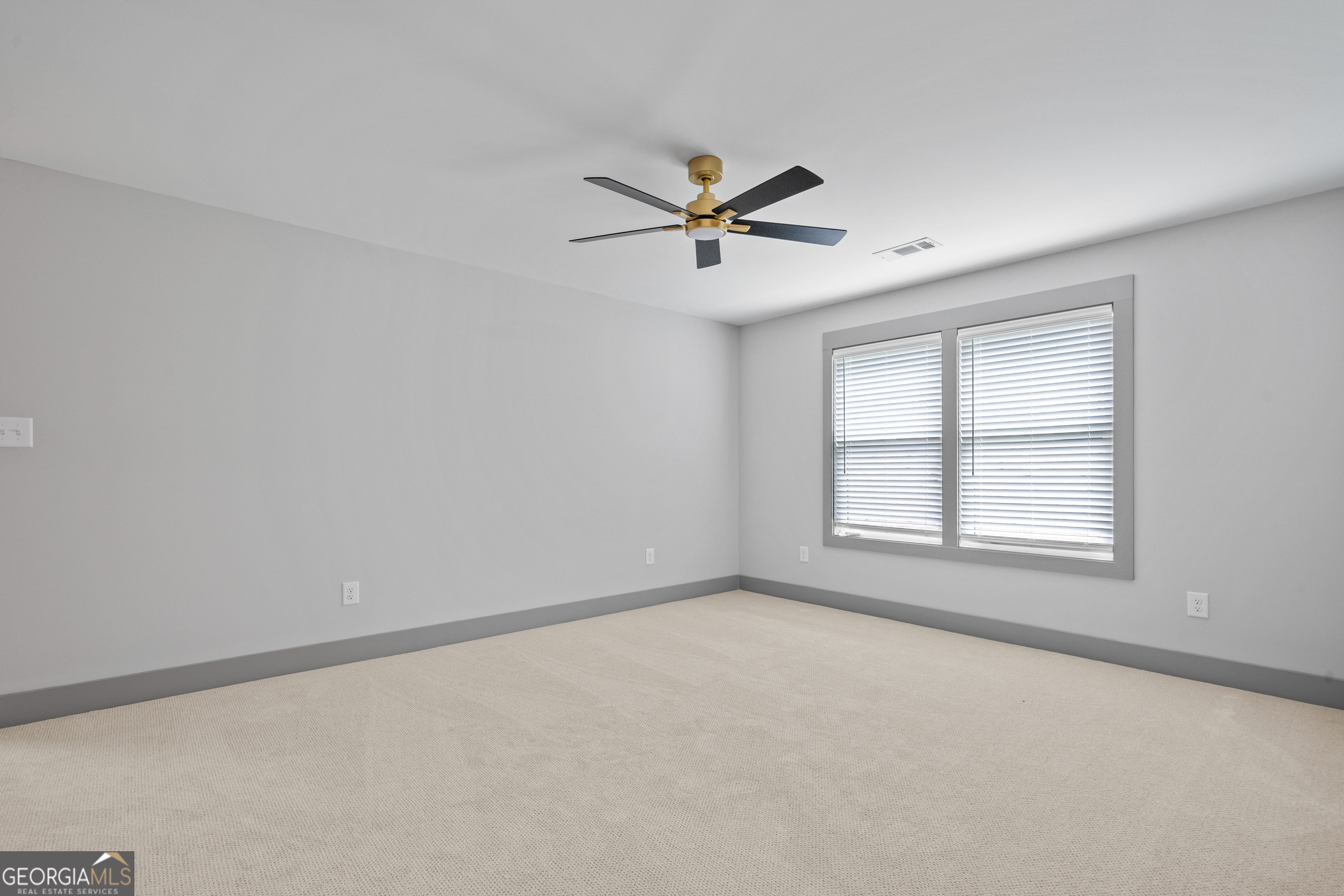 303 Tumbling Shoals Court Gray, GA 31032 - Photo 65 of 86 a view of a livingroom with a ceiling fan and window