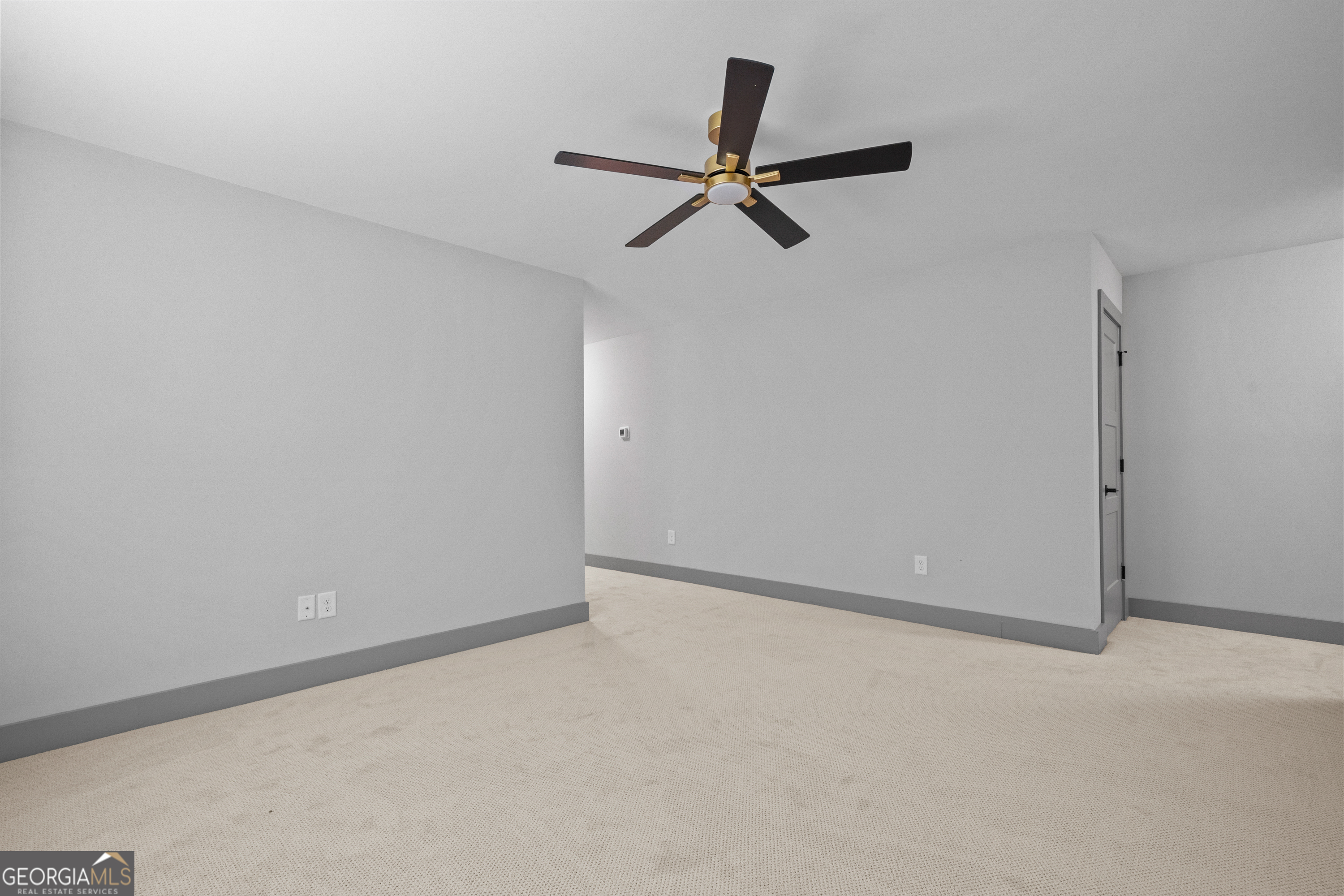 303 Tumbling Shoals Court Gray, GA 31032 - Photo 66 of 86 a view of a big room with a ceiling fan