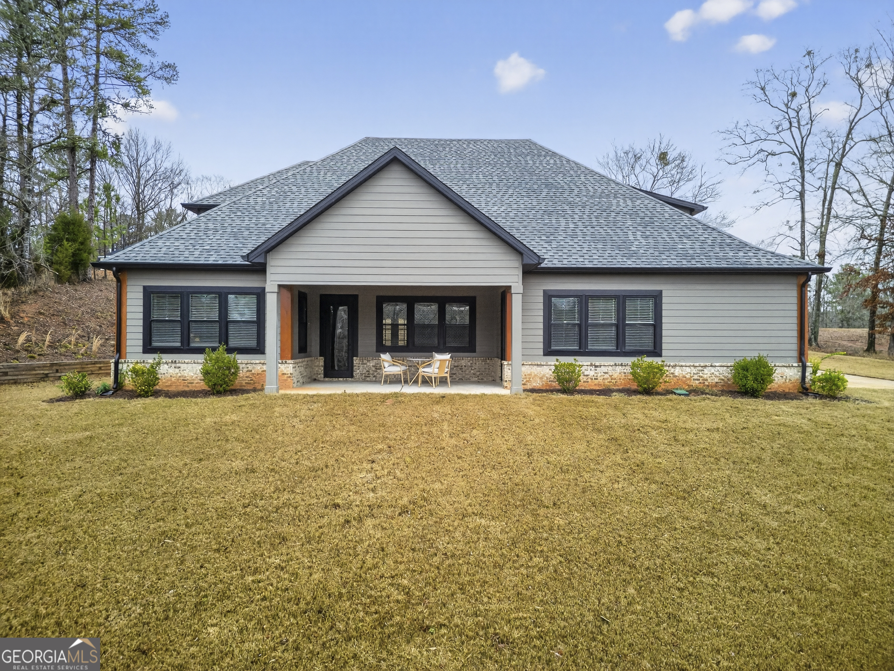 303 Tumbling Shoals Court Gray, GA 31032 - Photo 71 of 86 a front view of house with yard and green space